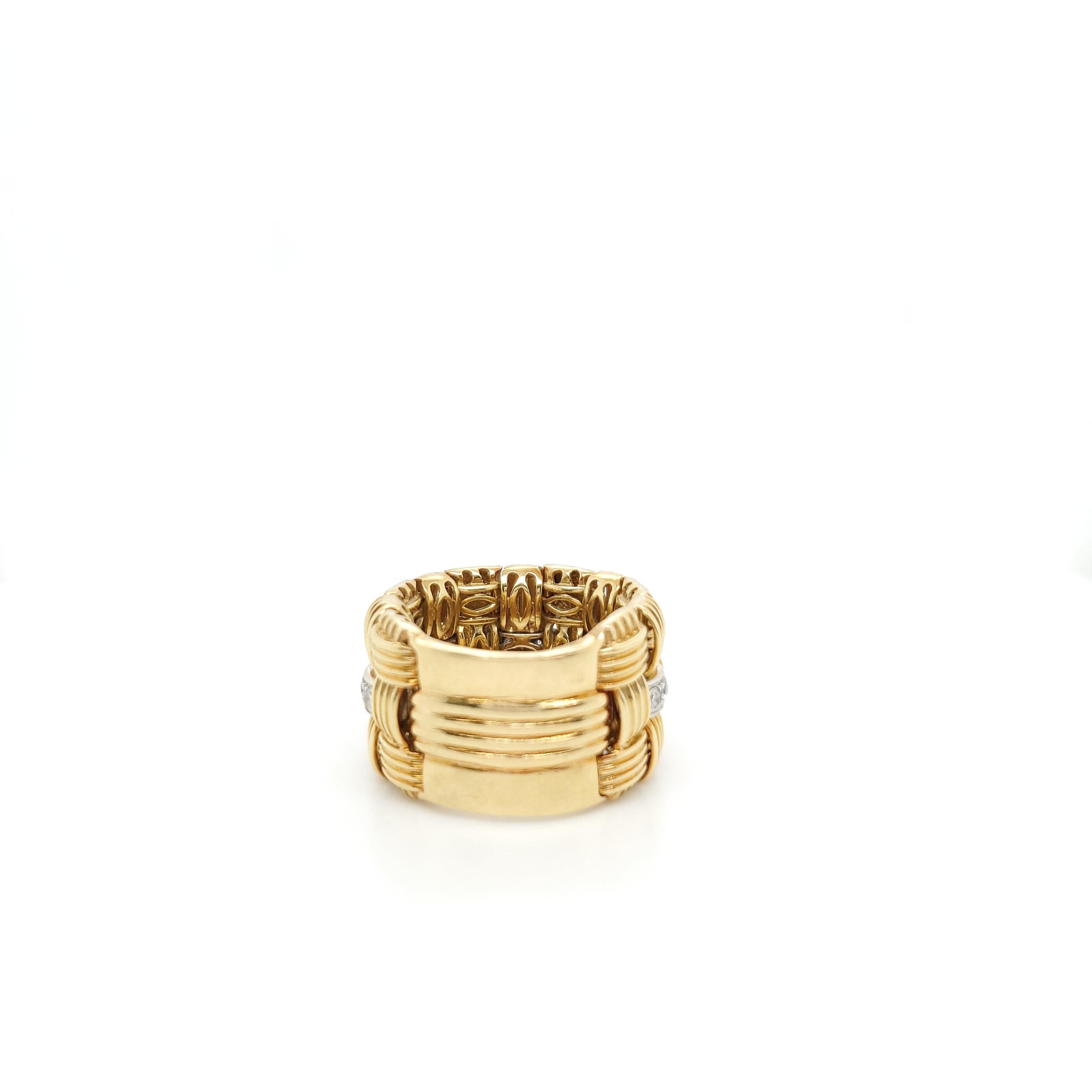 Authentic Roberto Coin 18 karat yellow gold flexible three-row woven look ring with diamonds from the Appassionata collection. The round brilliant cut diamonds (F-G in color, VS-SI clarity) estimated at 0.15 carats total are set in 18 karat white