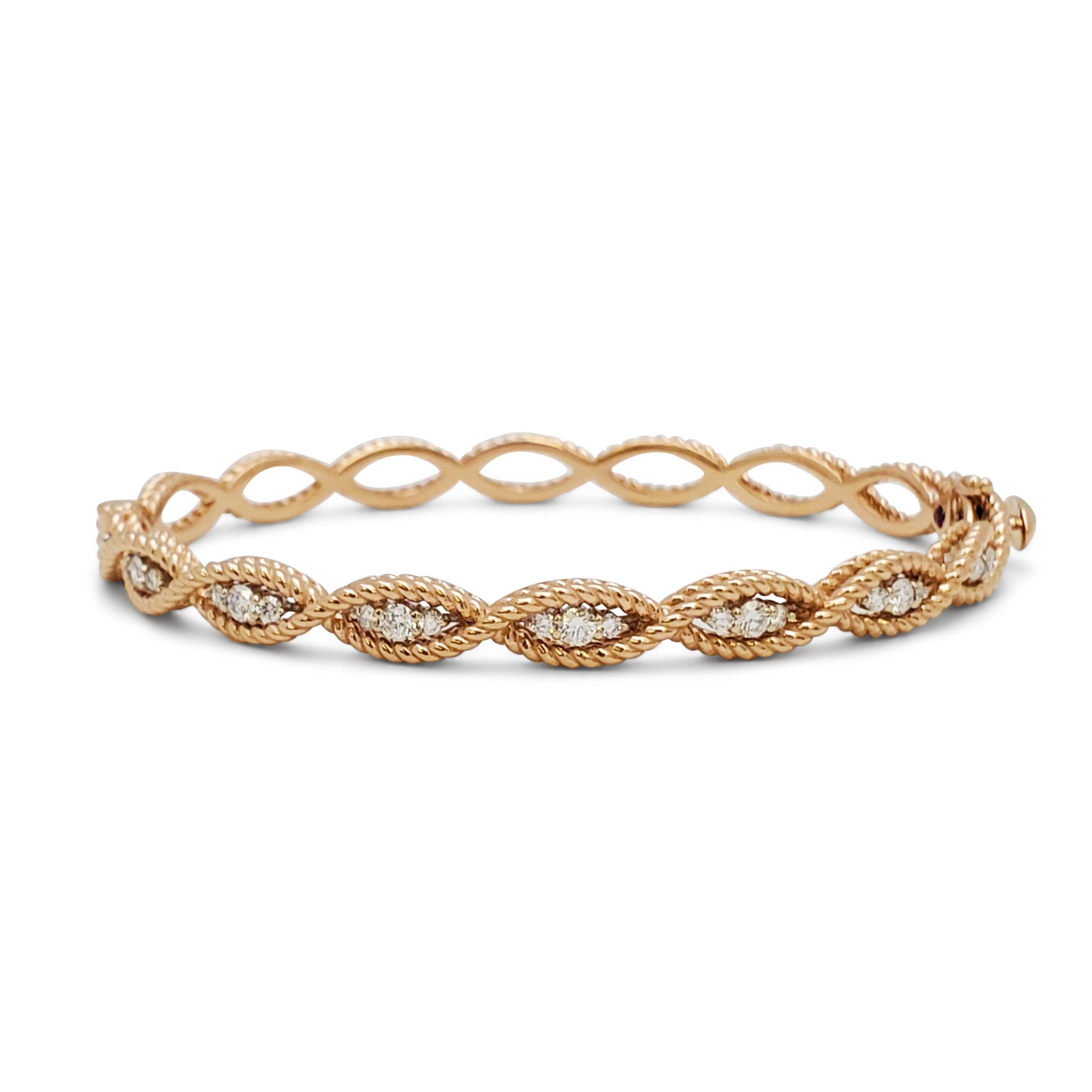 Authentic Roberto Coin 'Barocco' bracelet crafted in 18 karat rose gold.  Half of the twisted rope design is set with an estimated .56 carats of sparkling round brilliant diamonds. The bracelet measures 5mm wide with an internal circumference of 6