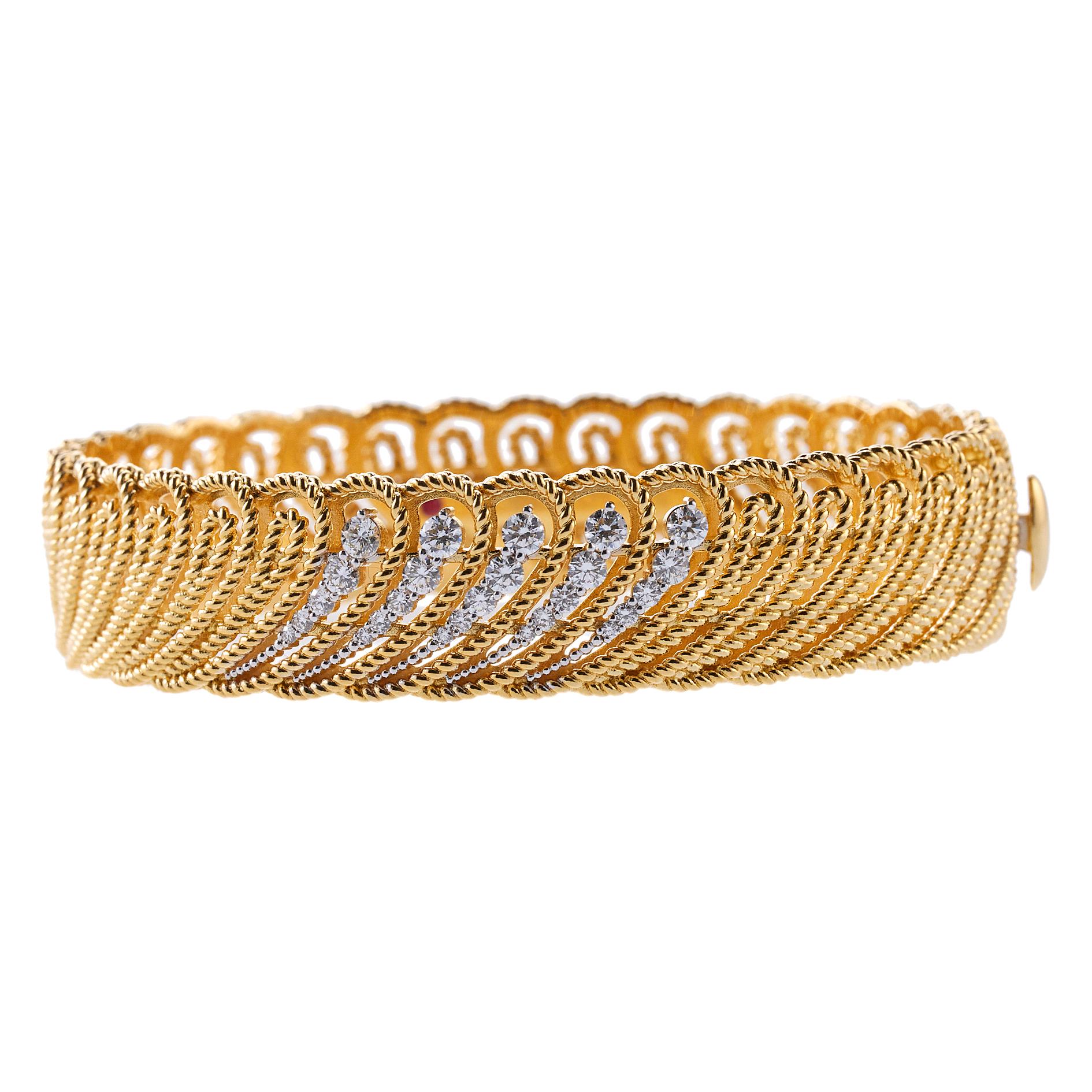 18K yellow gold Roberto Coin bangle bracelet set with 0.75ctw in G/VS diamonds. Bracelet will fit approx. 6.75