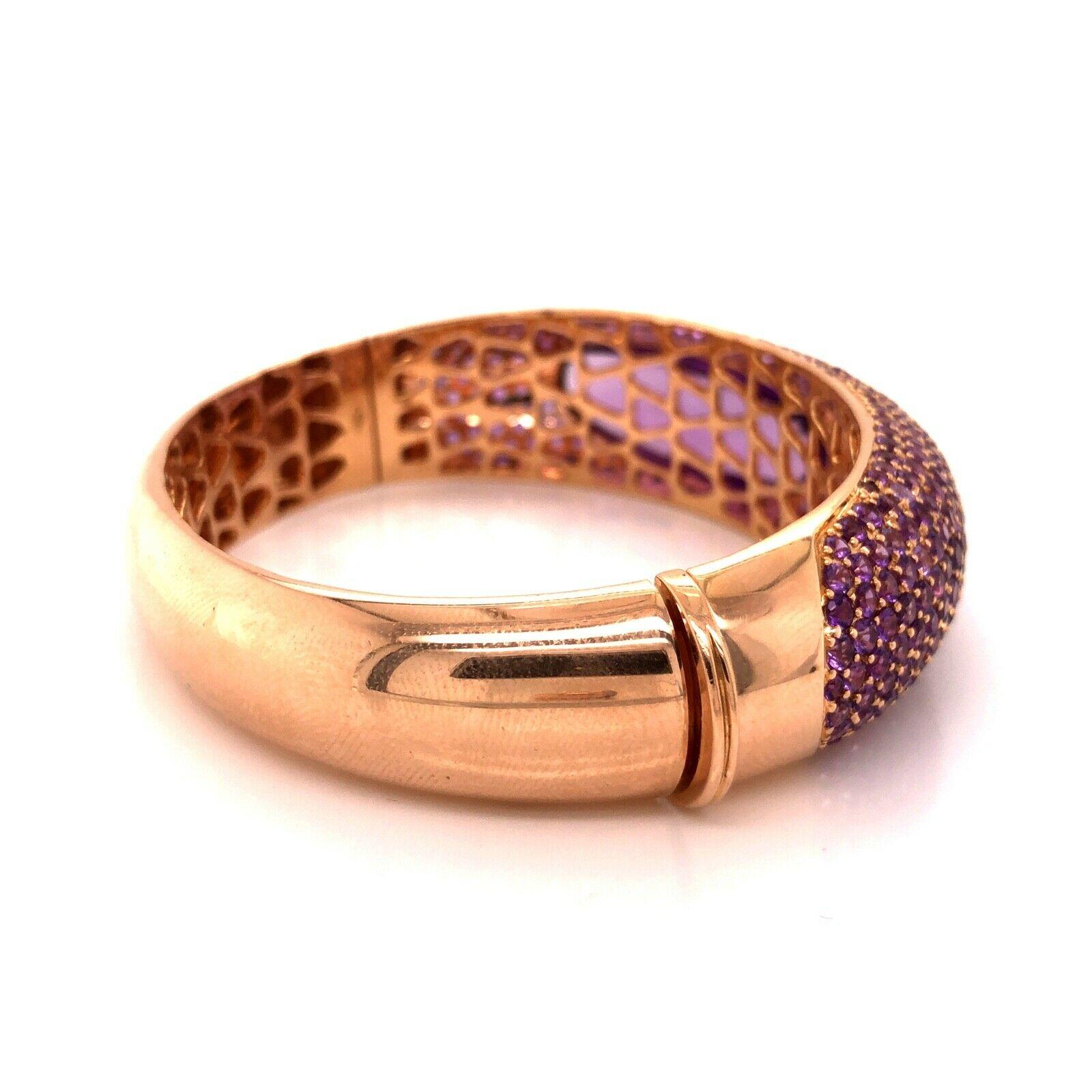 Beautiful creation from famed designer Roberto Coin. This elegant bangle/ bracelet is crafted in 18k rose gold showing a edgy look with Amethyst gemstones set throughout. This is the wider version of this design. The bangle is part of his Capri Plus