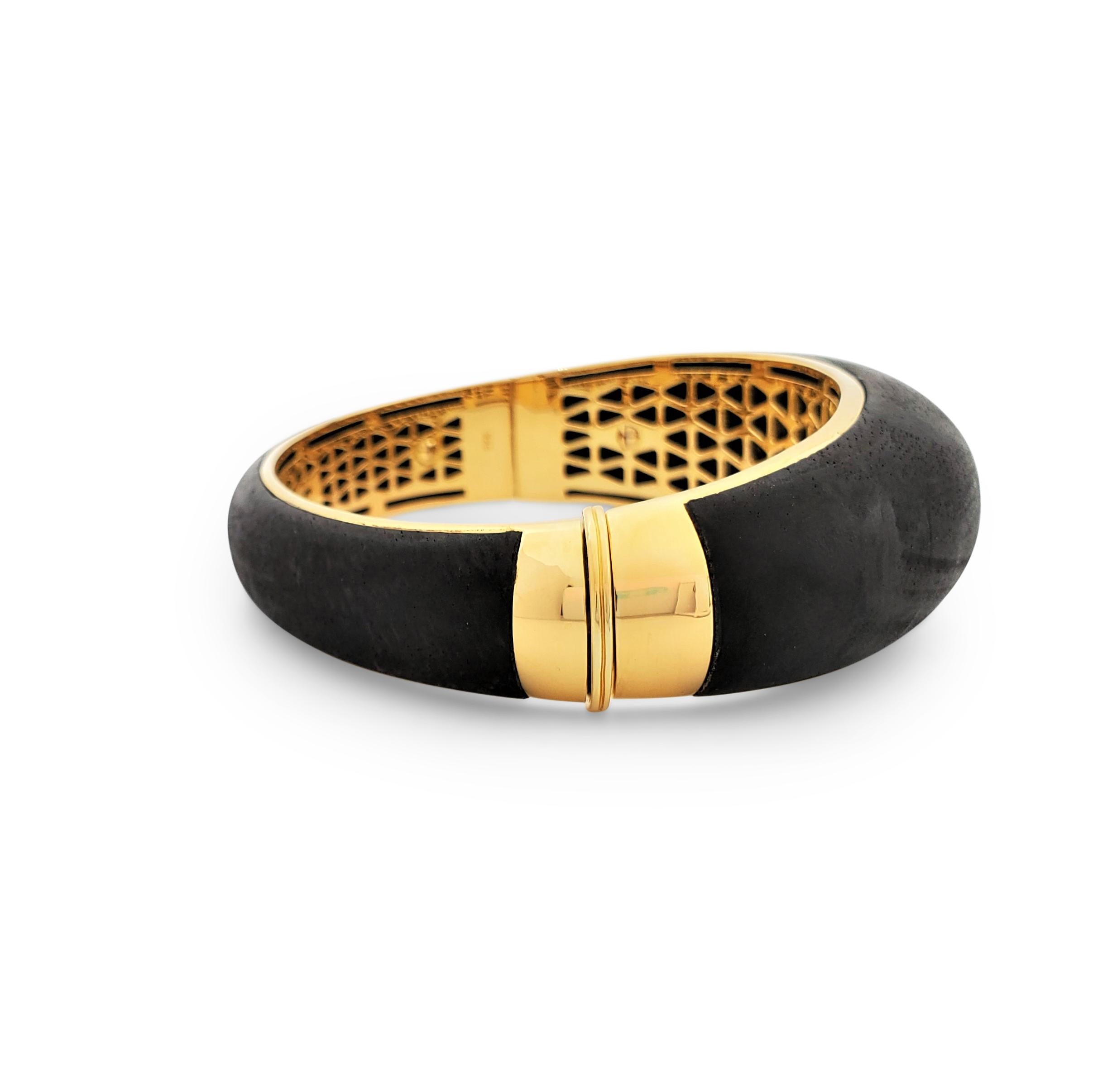 Authentic Roberto Coin 'Capri Plus' bangle bracelet crafted from ebony wood and accented with an estimated 2.30 carats of cognac-colored pave diamonds set into gold plated sterling silver. Signed Roberto Coin, 925, with signature ruby stone.