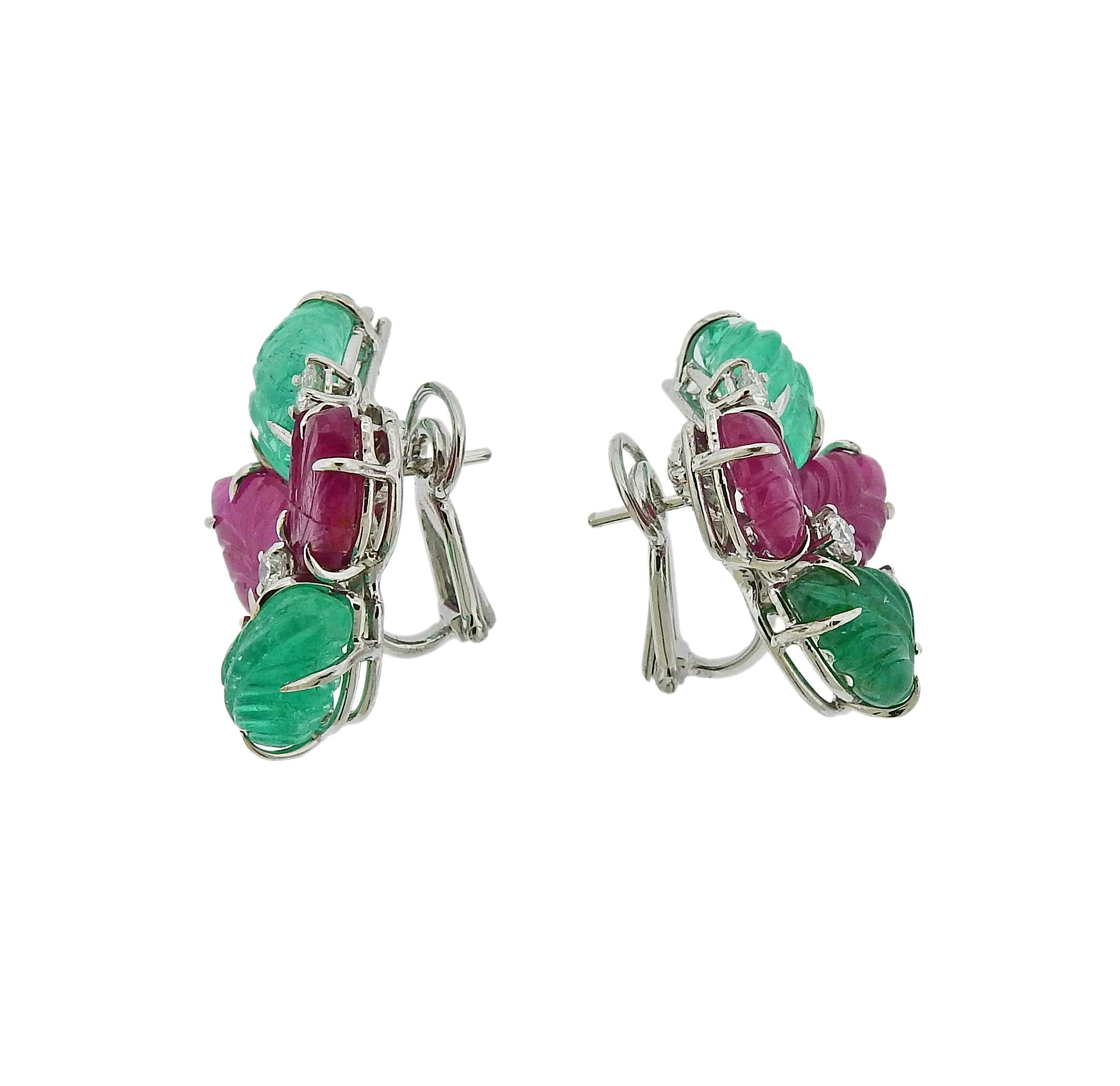 Pair of beautiful 18k white gold tutti frutti earrings, crafted by Roberto Coin, set with approx. 4.50ctw in carved rubies, 4.75ctw in carved emeralds and approx. 0.30ctw in G/VS diamonds.  Earrings are 28mm x 18mm. Weigh 13 grams. Marked: 750,