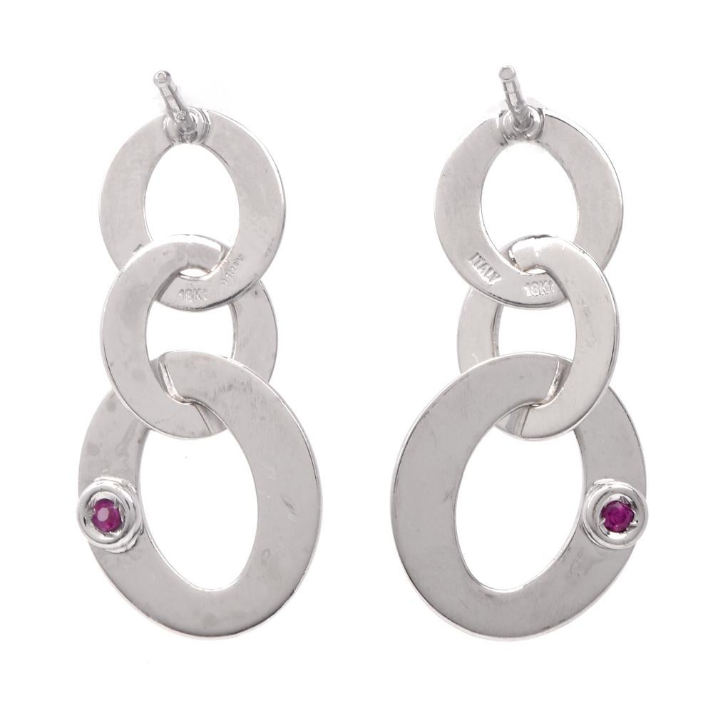 These stylish Roberto Coin chic and shine collection chain link drop earrings are crafted in 18-karat white gold. Composed of three flat oval chain links of varying sizes, weighing 3.6 grams and measuring 23mm long x 12mm wide. Secure with post and