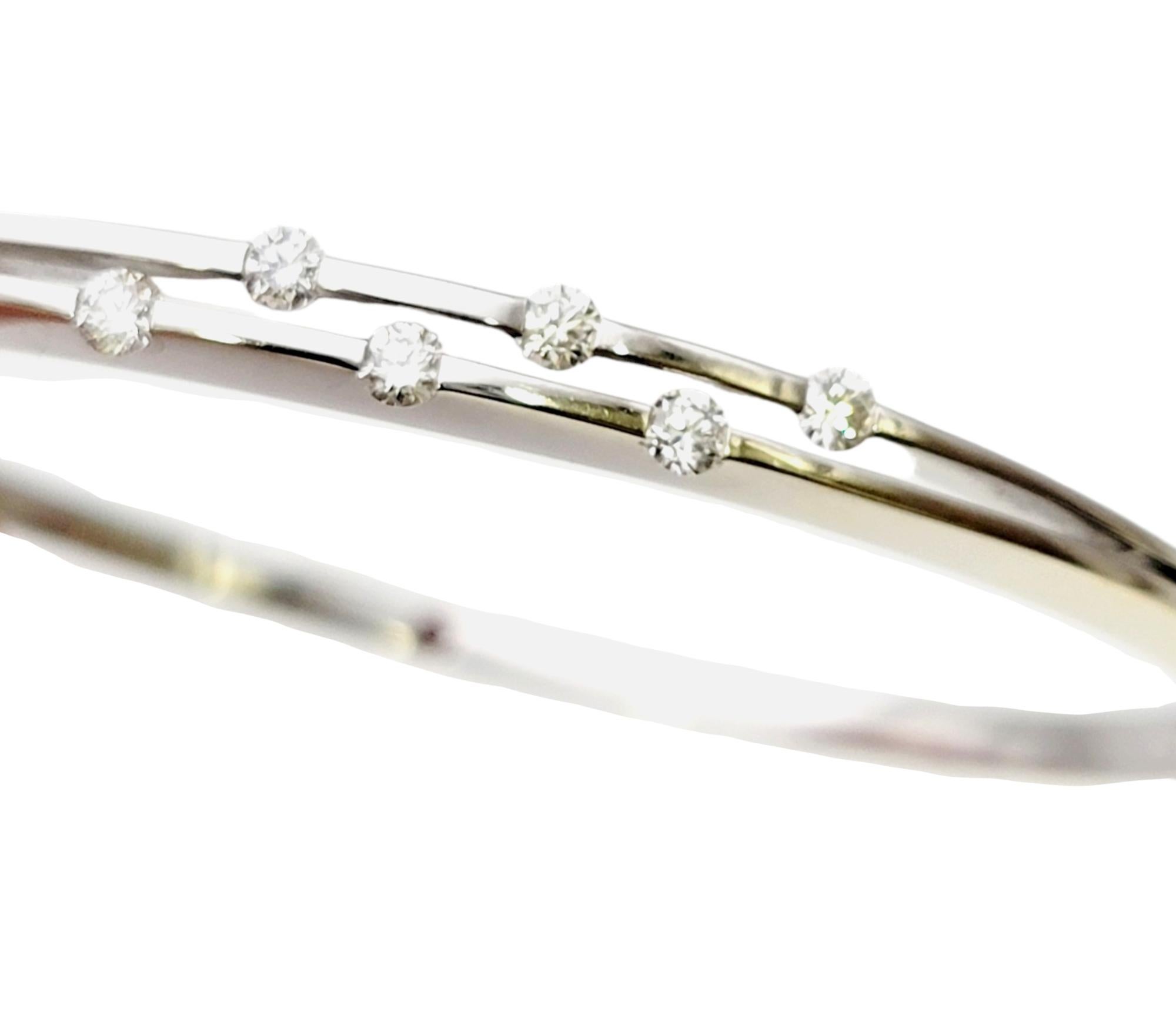 Simple yet stunning bracelet from Roberto Coin's Classica Parisienne  collection. Uncomplicated with a modern appeal, this sleek bangle exudes luxury and style.

This contemporary bracelet features a polished 18 karat white gold bangle embellished