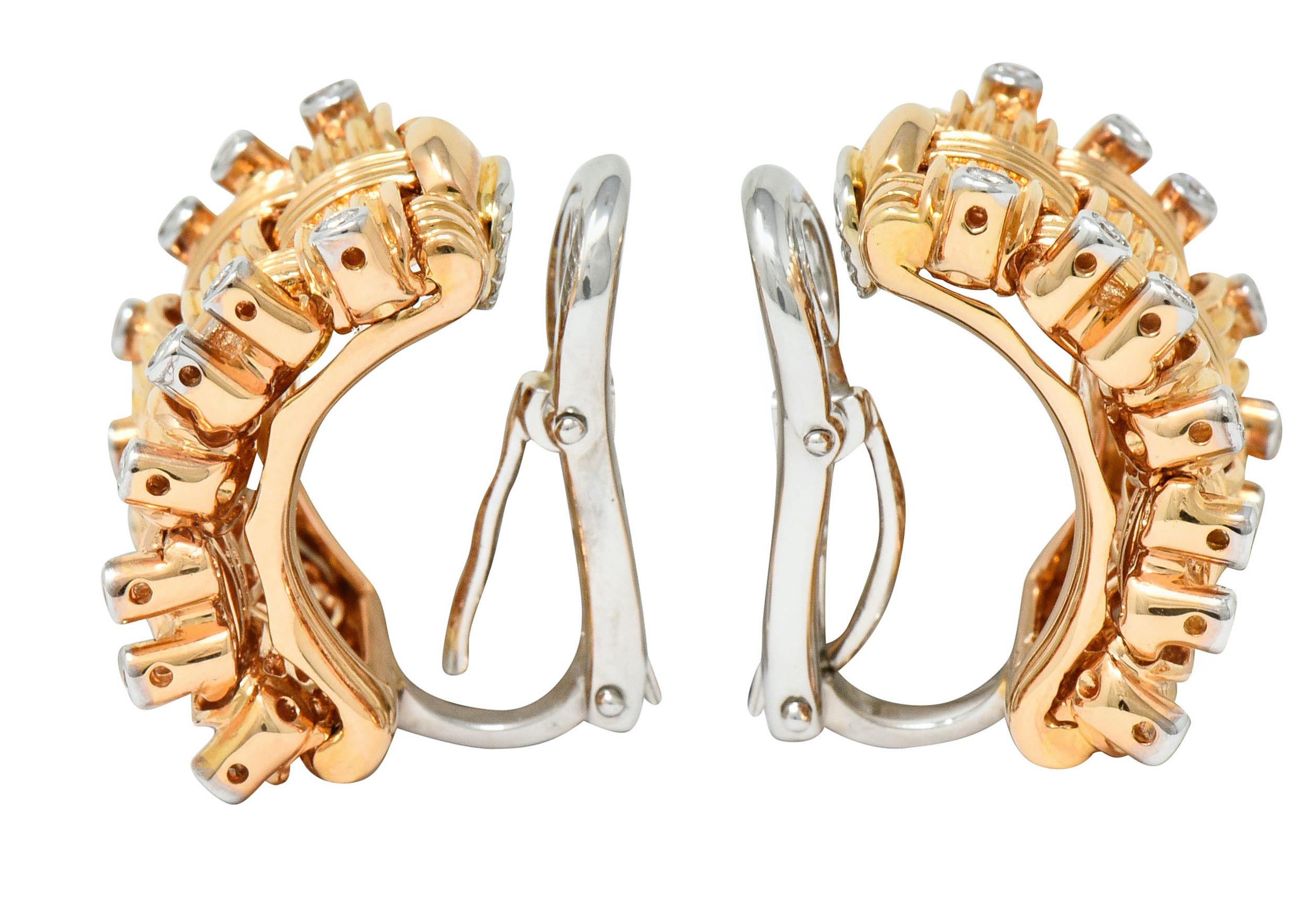 Earrings are designed as a brightly polished woven motif; slightly articulated

Flanked by bezel set round brilliant cut diamond edges

Weighing in total approximately 0.42 carat; G/H color with SI clarity

Completed by white gold hinged omega backs