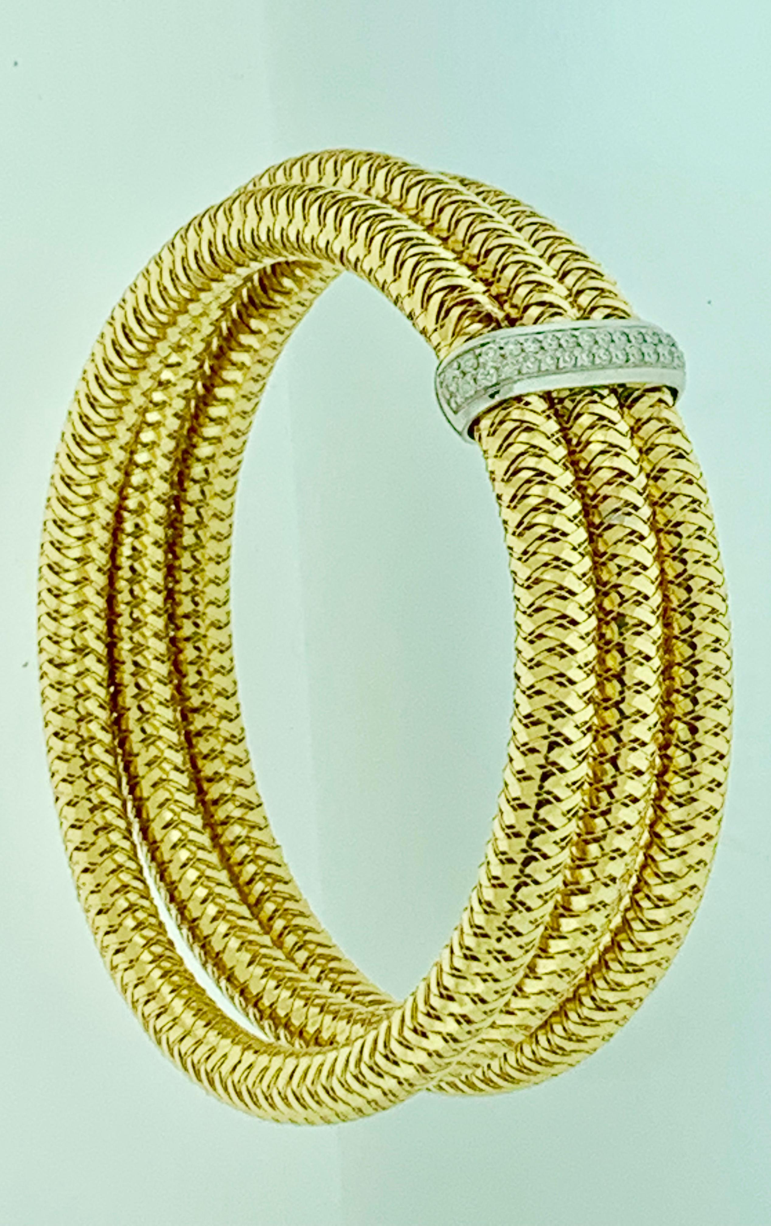 Roberto Coin Diamond  Bangle  Three Row Bracelet In 18 Karat Yellow Gold Estate
This is a stretchable bracelet so does not have any clasp  .
Diamonds : Approximately 1 Carat
18K Yellow  gold  : 39 Grams
It features a bangle style  Bracelet crafted