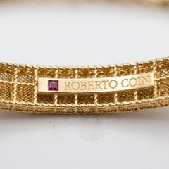 Pulsera tipo brazalete «Diamond Daisy» de Roberto Coin, en oro amarillo de 18 quilates