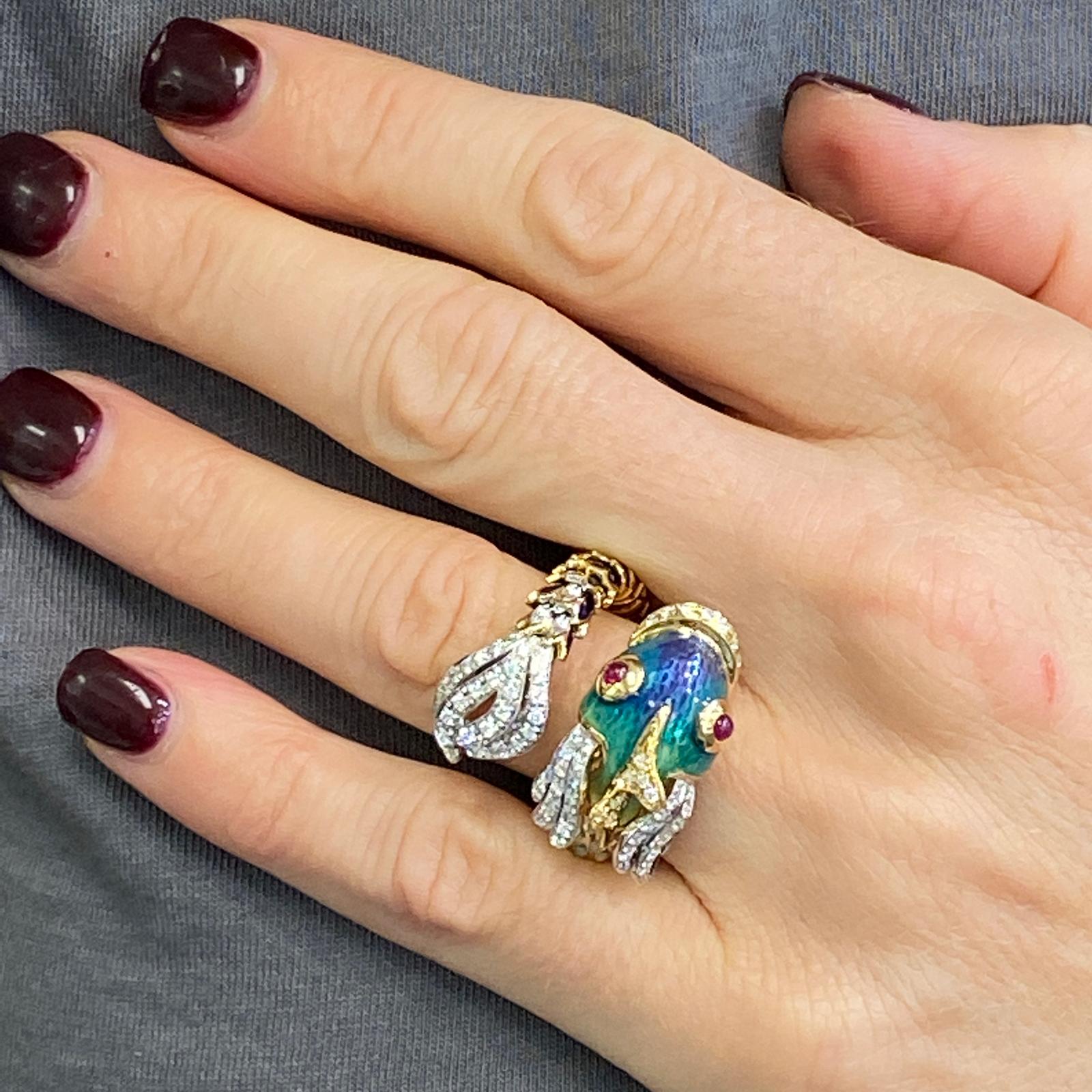 Fabulous and colorful Diamond Enamel Nemo ring by Italian designer Roberto Coin. The ring features 75 round brilliant cut diamonds weigh .65 carats graded G-H color and VS clarity. The ring is crafted in 18 karat yellow gold, is adorned with blue