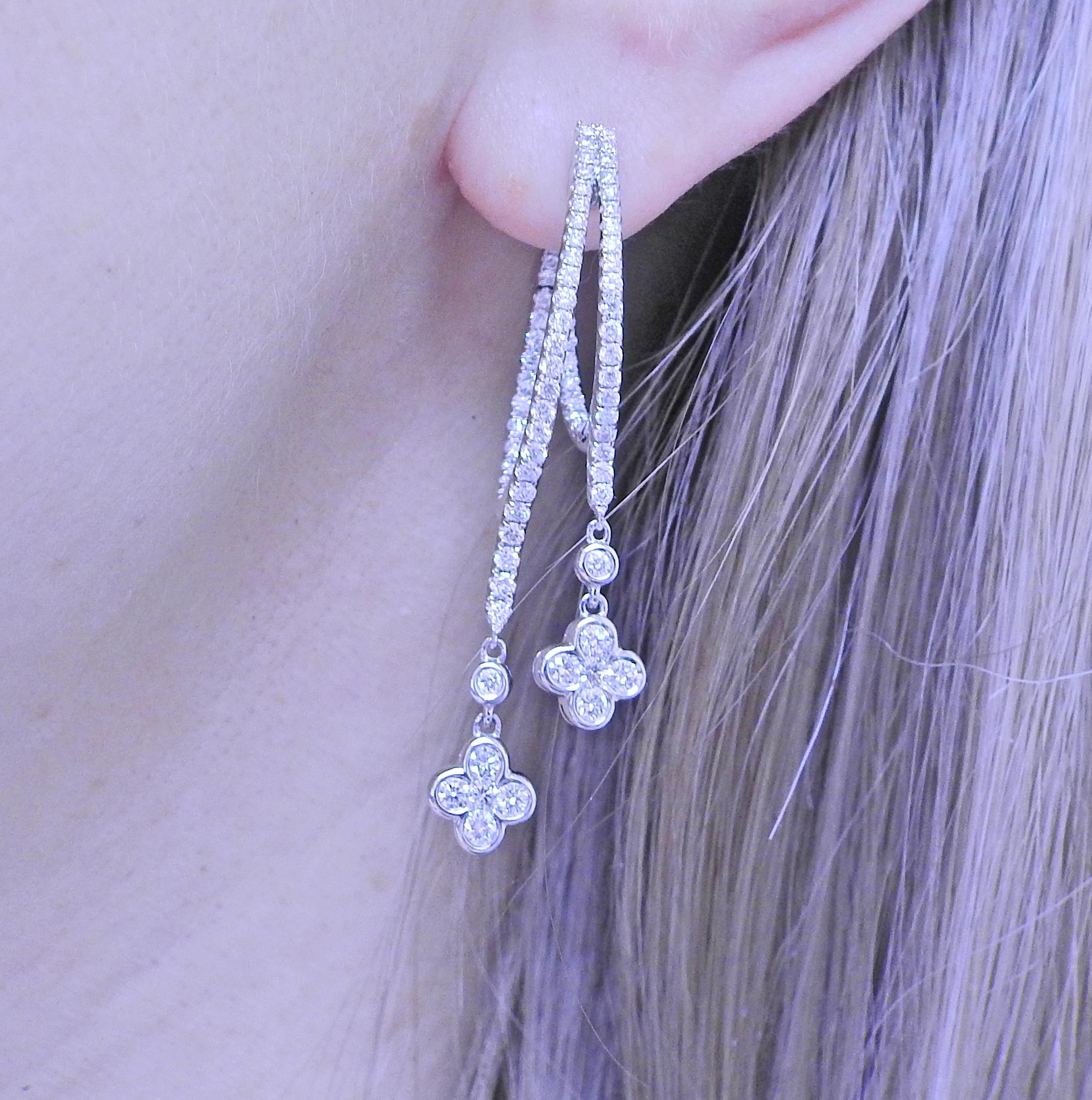 Pair of 18k white gold drop earrings by Roberto Coin, set with 2.00ctw in G/VS diamonds. Earring measure 50mm (2