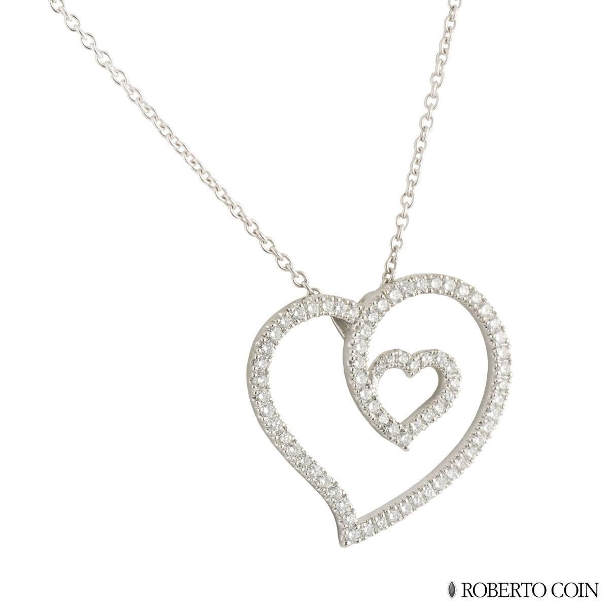 A stylish 18k white gold diamond Roberto Coin heart pendant. The pendant comprises of an open work double heart motif with 74 round brilliant cut diamonds in a shared claw setting. The diamonds have a total weight of approximately 0.96ct, G colour,
