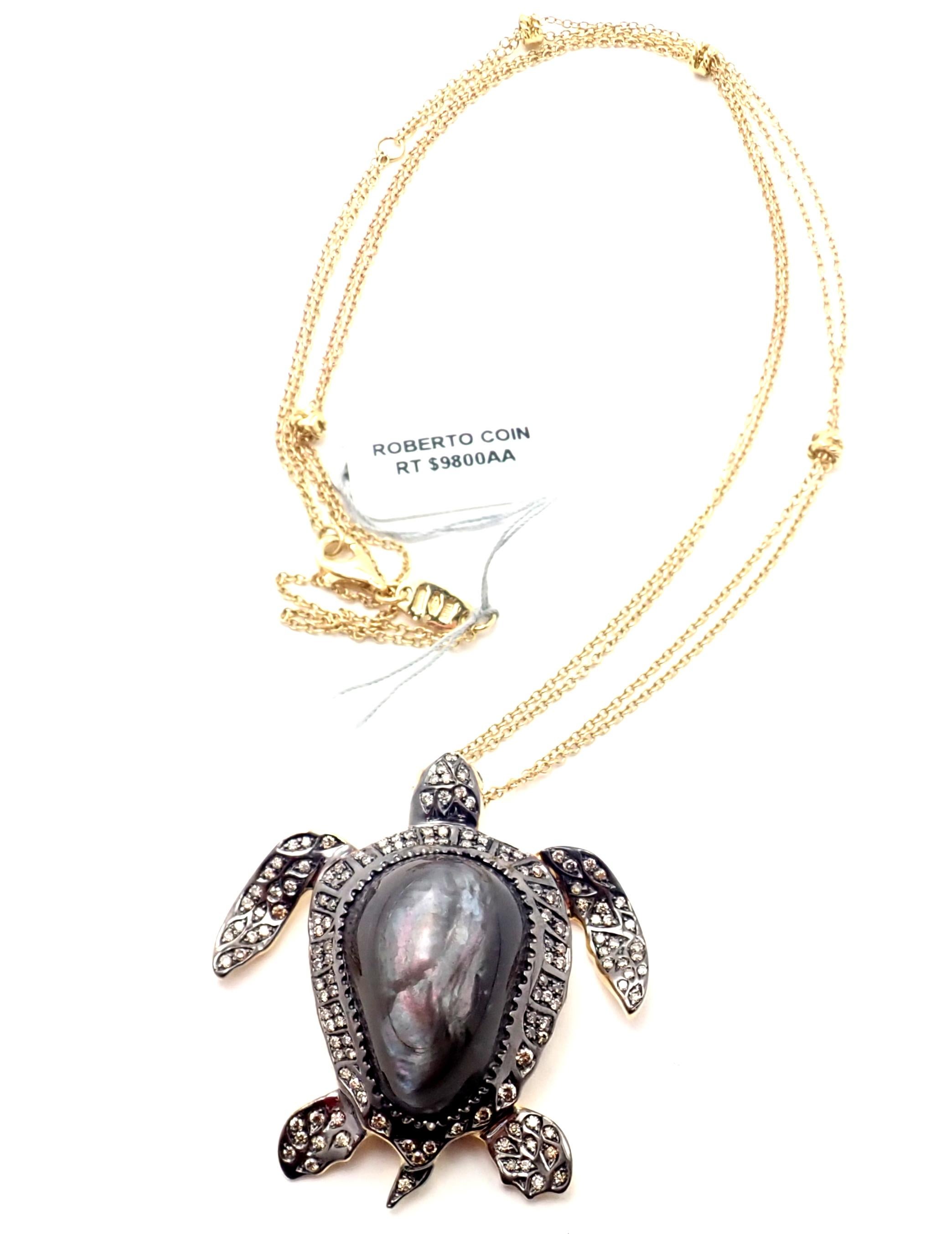 18k White Sea Turtle Diamond And Mother Of Pearl Pendant Necklace by Roberto Coin. 
With Round brilliant cut diamonds total weight approx. 1.07ct
2 Rubies one on a pendant second on a chain.
This necklace is in new condition and it comes with RC box