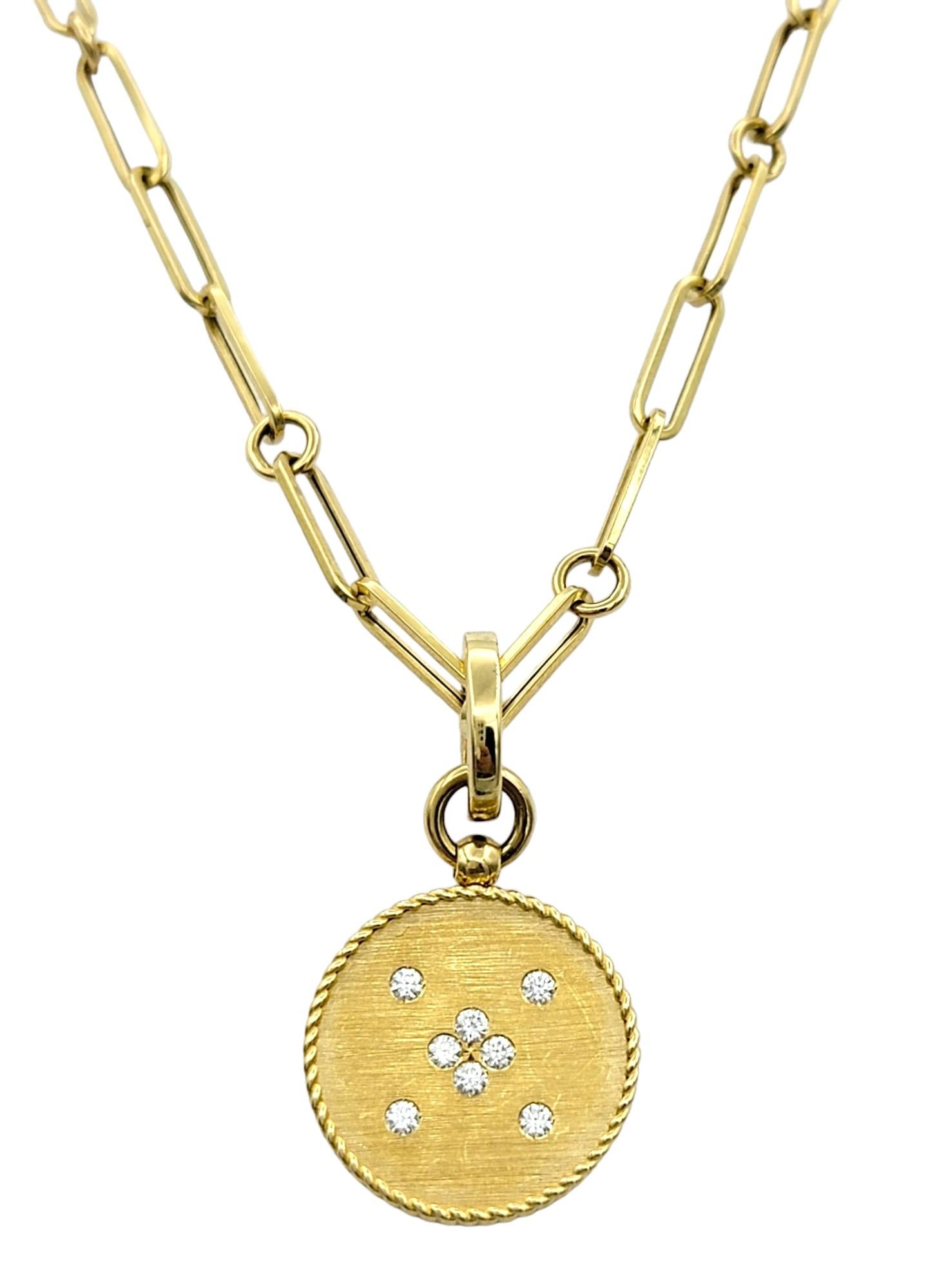 This stunning Roberto Coin Diamond Scorpio Zodiac necklace is a celestial masterpiece that seamlessly blends luxurious craftsmanship with astrological symbolism. Crafted from opulent 18-karat yellow gold, the pendant features the Greek symbol for