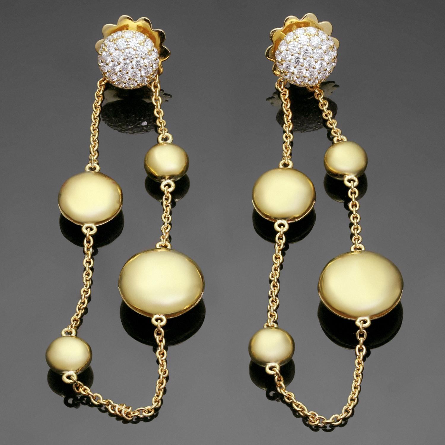 These stunning Robert Coin earrings are designed for pierced ears and feature a dangling chain design accented with round pebbles crafted in 18k yellow gold and set with full-cut diamonds weighing an estimated 0.75 carats. Stamped RC for Roberto