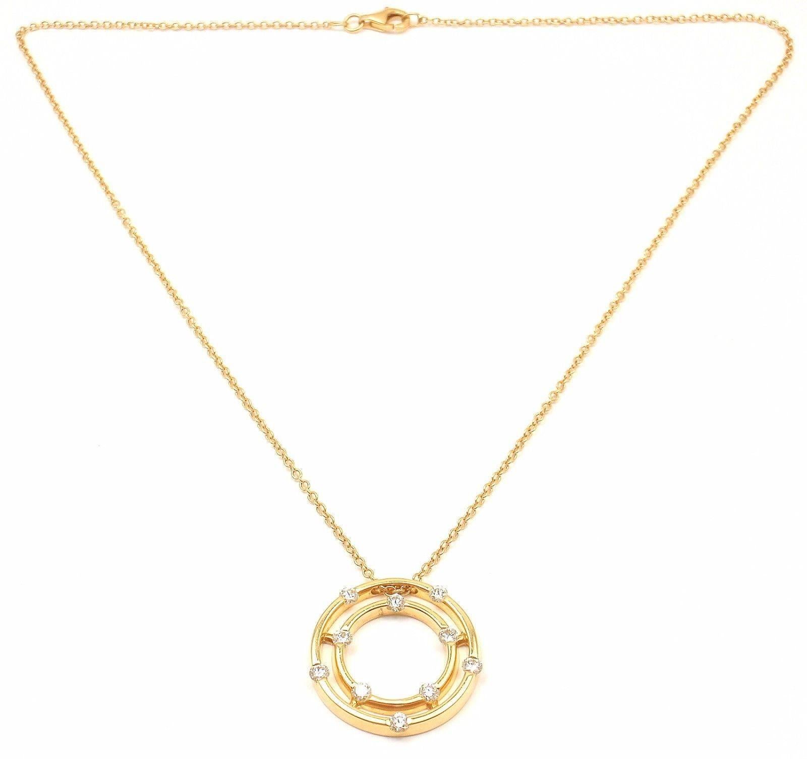 18k Yellow Gold Double Hoop Diamond Pendant Necklace by Roberto Coin. 
With 10 round brilliant cut diamonds SI1 clarity, G color total weight .72ct

Details: 
Necklace: 15.5'' inches long
Pendant: 22mm
Weight: 7.9 grams
Stamped Hallmarks: Makers