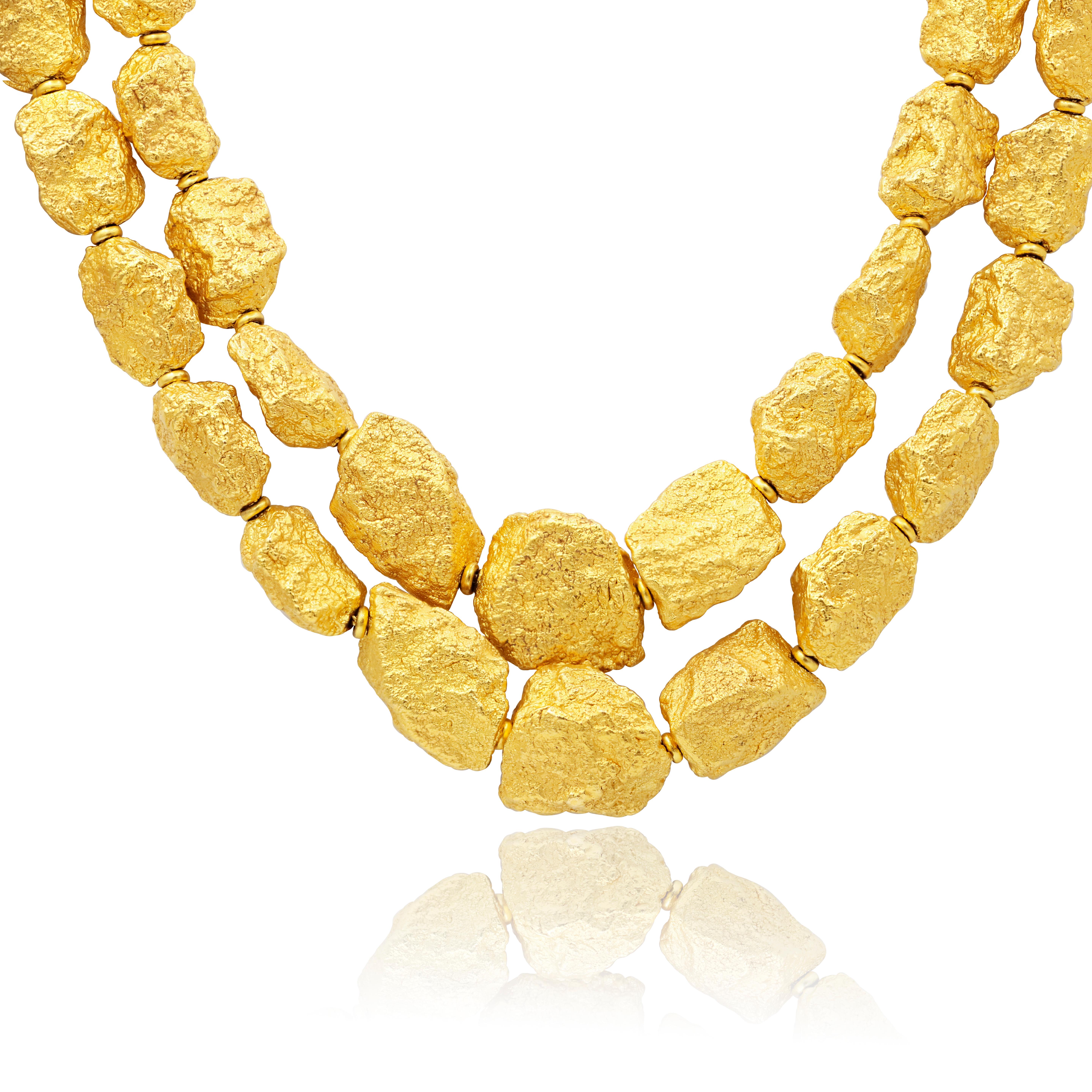 Roberto Coin fancy necklace comprised of 18ct yellow gold hollow links that are fashioned in the shapes of gold nuggets.

Length: 18