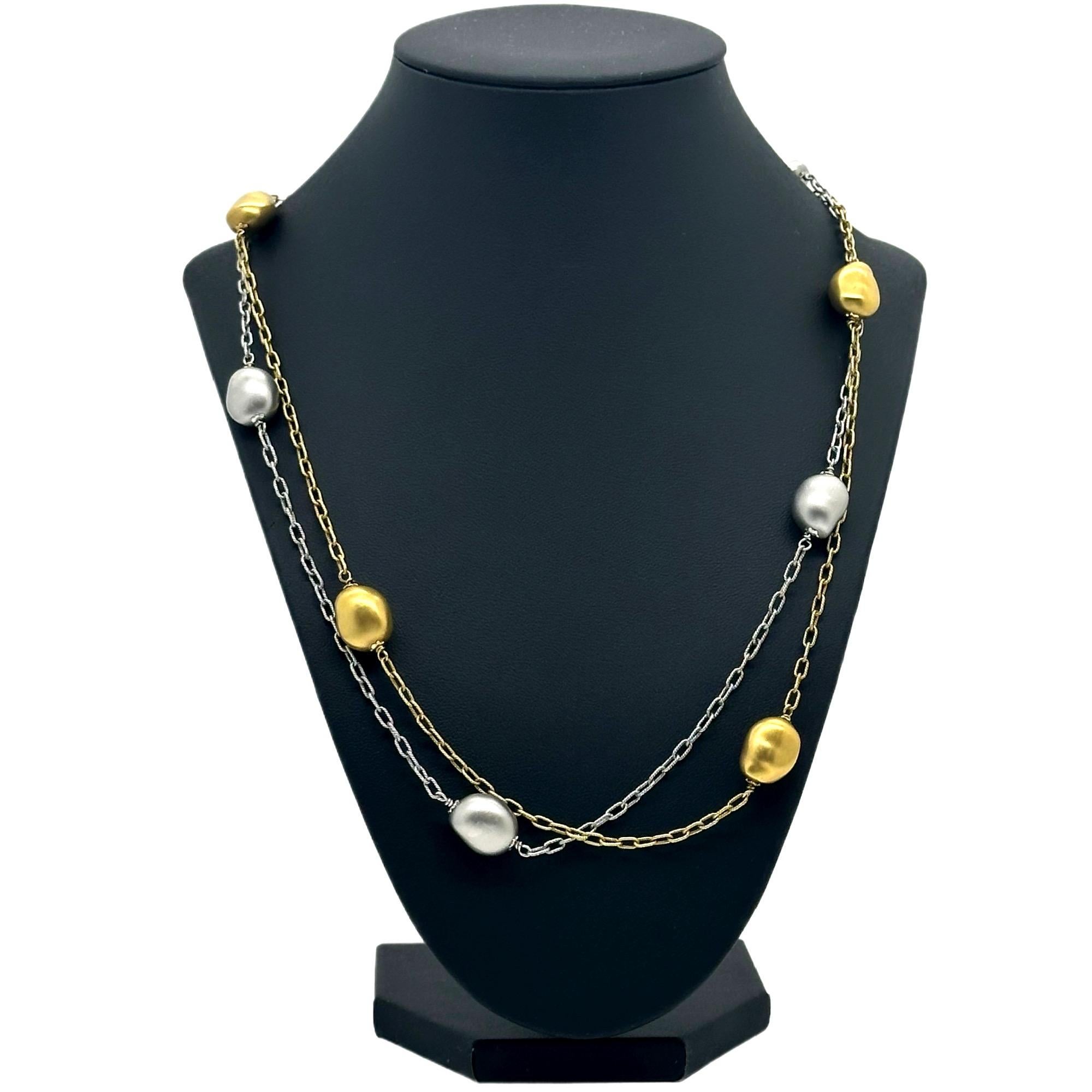 Roberto Coin Nugget Collection Double Strand Two-Toned Necklace
Style:  Double Strand with Toggle Closure
Metal:  18kt White & Yellow Brushed Gold
Size / Measurements:  22' Inches
Size:  ~ 9 MM Nugget Size
Weight:  31.7 Grams
Hallmark:  18KT ITALY
