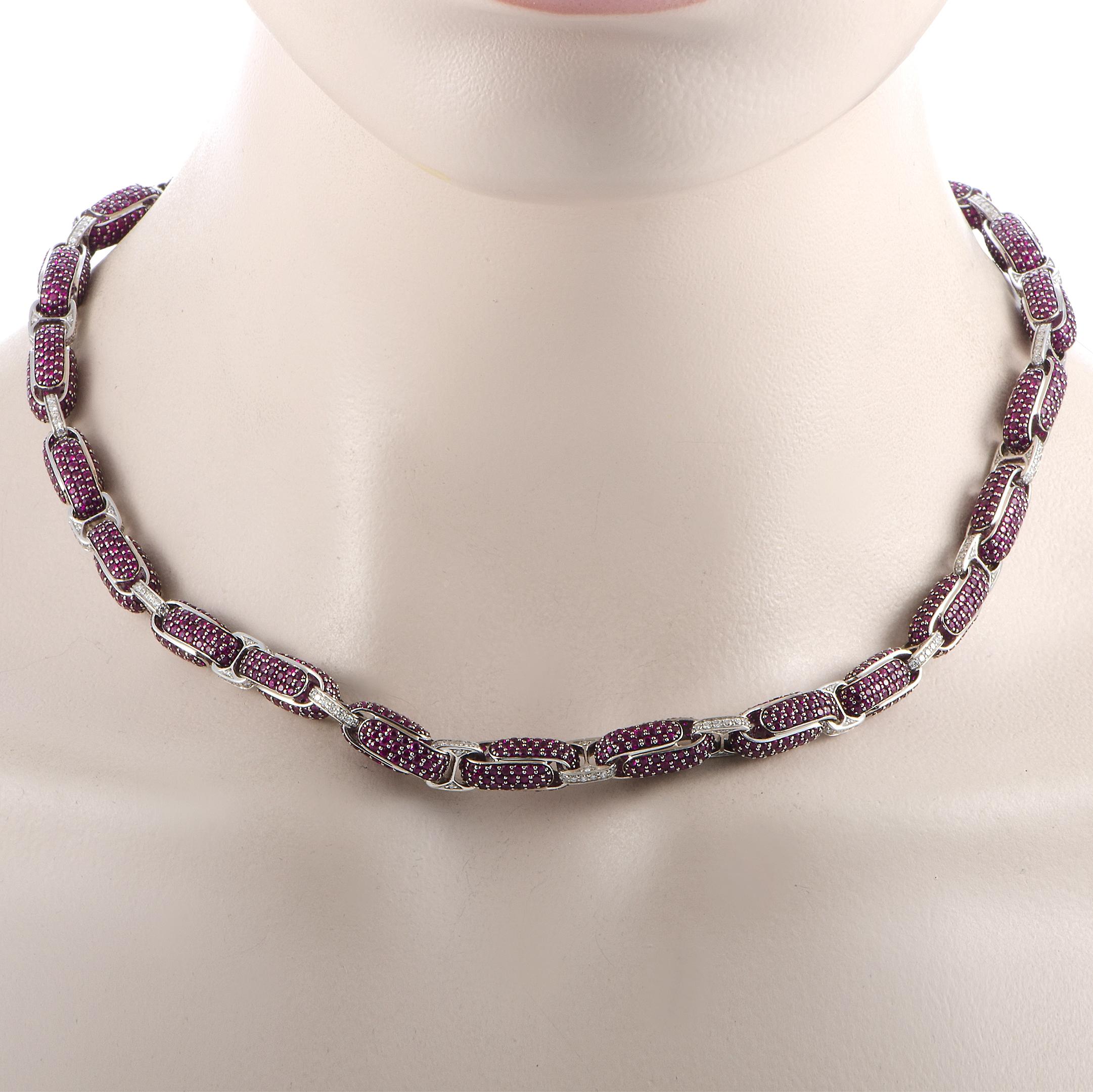 The Roberto Coin “Fantasia” necklace is crafted from 18K white gold and weighs 70 grams. It is set with diamonds and rubies that total 3.75 and 40.00 carats respectively. The necklace features a fold over clasp and measures 19” in length.

This