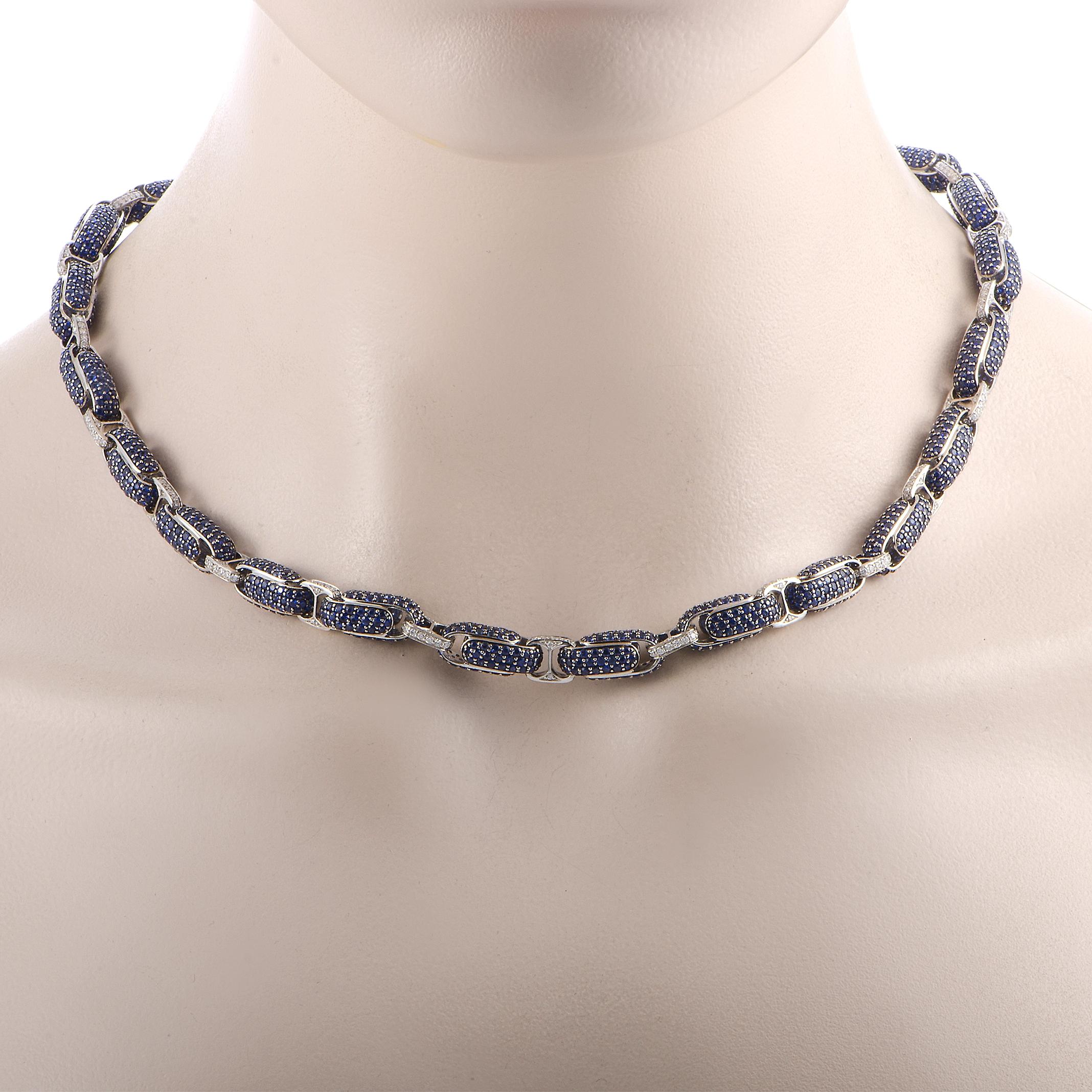 The Roberto Coin “Fantasia” necklace is crafted from 18K white gold and weighs 70 grams. It is set with diamonds and sapphires that total 3.90 and 40.00 carats respectively. The necklace features a fold over clasp and measures 19” in length.

This