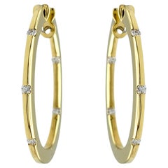 Roberto Coin Boucles d'oreilles ovales plates avec diamants sertis en or jaune 18 carats