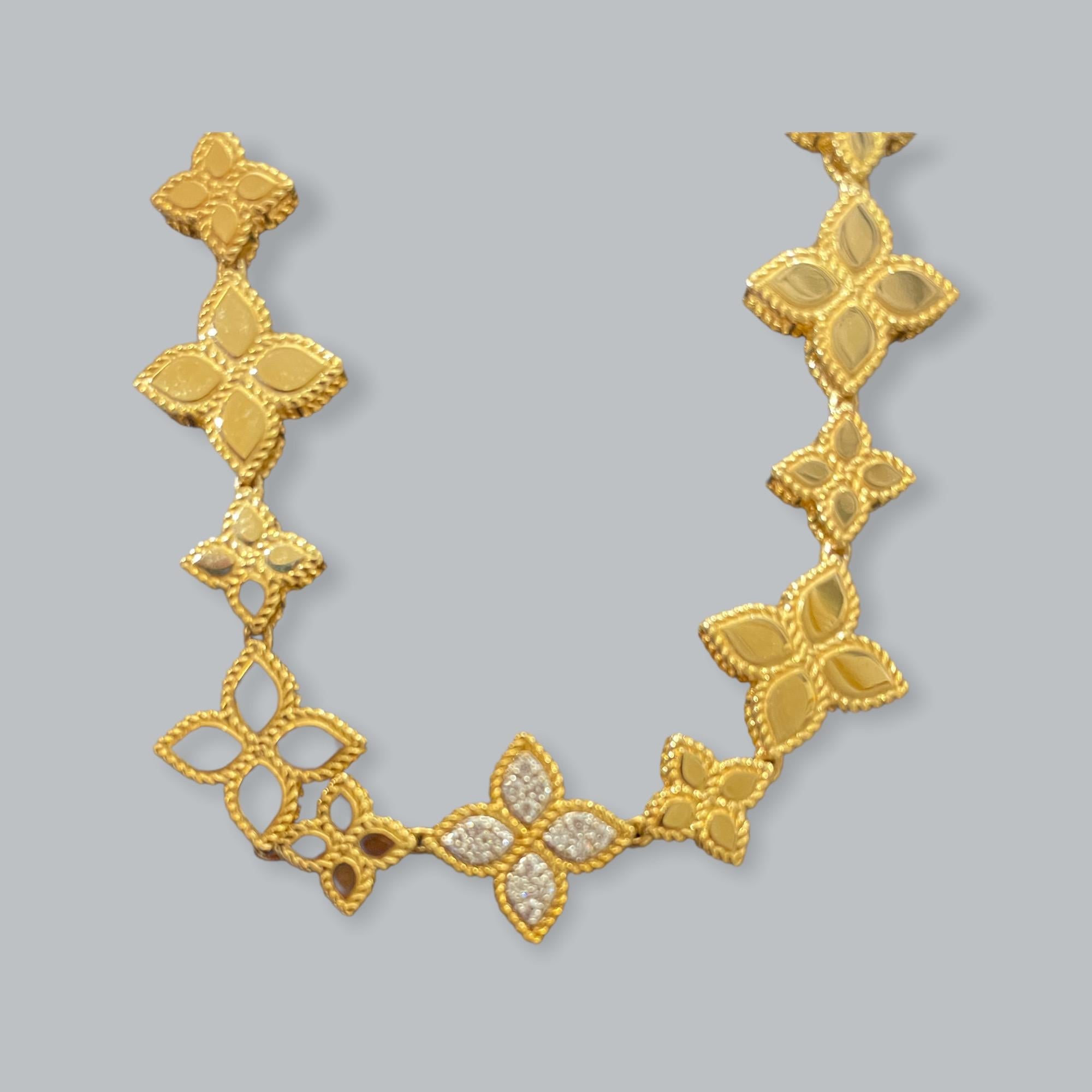 Each item in Roberto Coin's Princess collection is hand-chiseled into a regal design. 
Crafted in 18kt yellow gold this floral-motif necklace is fashionable and feminine.
Accented with .18cts of diamonds.

