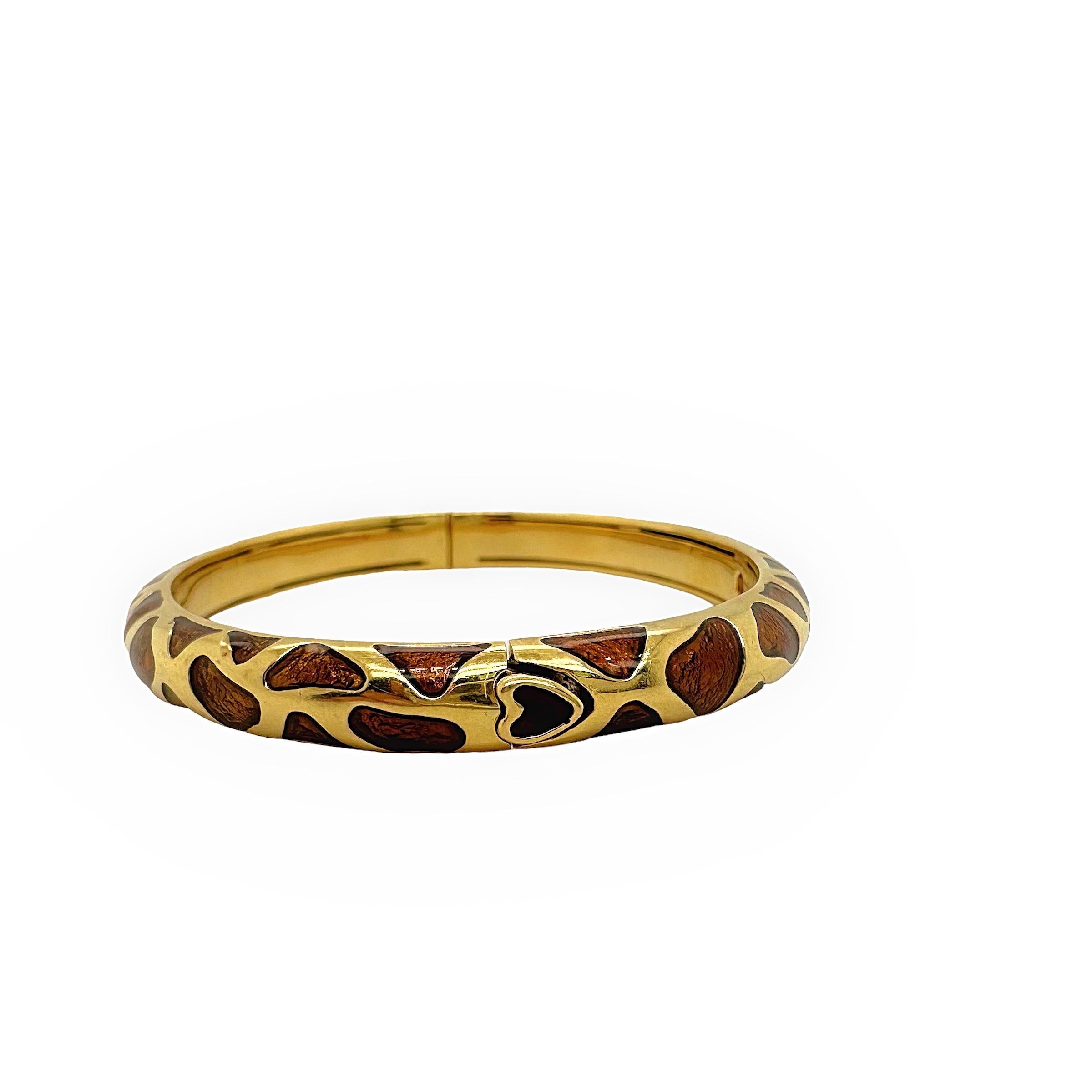 Roberto Coin Safarin Giraffe Bangle Bracelet
Style:   Bangle
Metal:  18kt Yellow Gold & Brown Enamel
Size:  6.5 inches - measured from the inside circumference
Width:  12 mm
Hallmark:  Roberto Coin Ruby
Includes:   Elegant Bracelet Box
Retail: 