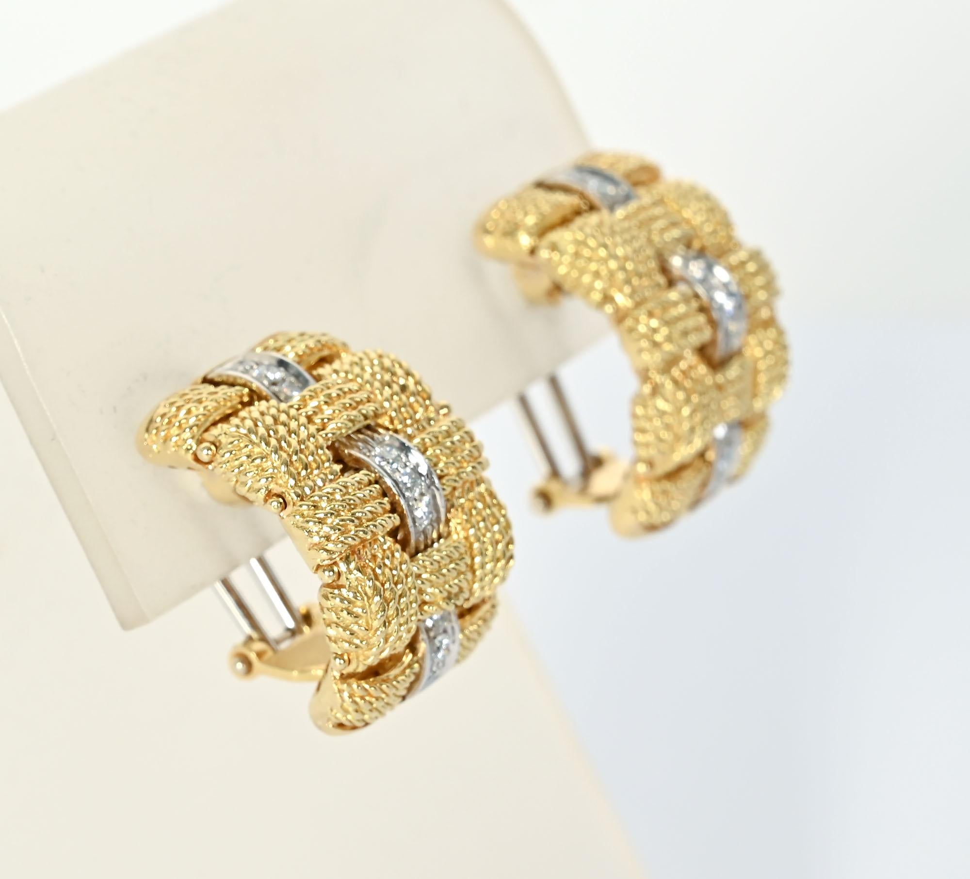 Elegant half hoop earrings in 18 karat gold with diamonds by Roberto Coin in his famous Appassionata pattern. Four rows of finely twisted gold are set at right angles  Set between them are three groups of three diamonds each set in white gold. The