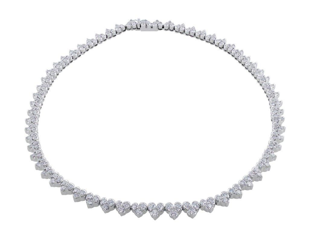 Beautiful Estate Roberto Coin white gold necklace with heart-shaped three stone clusters set with 93 diamonds in prong and half-bezel settings. The diamonds weigh a total of 7.44cttw.
