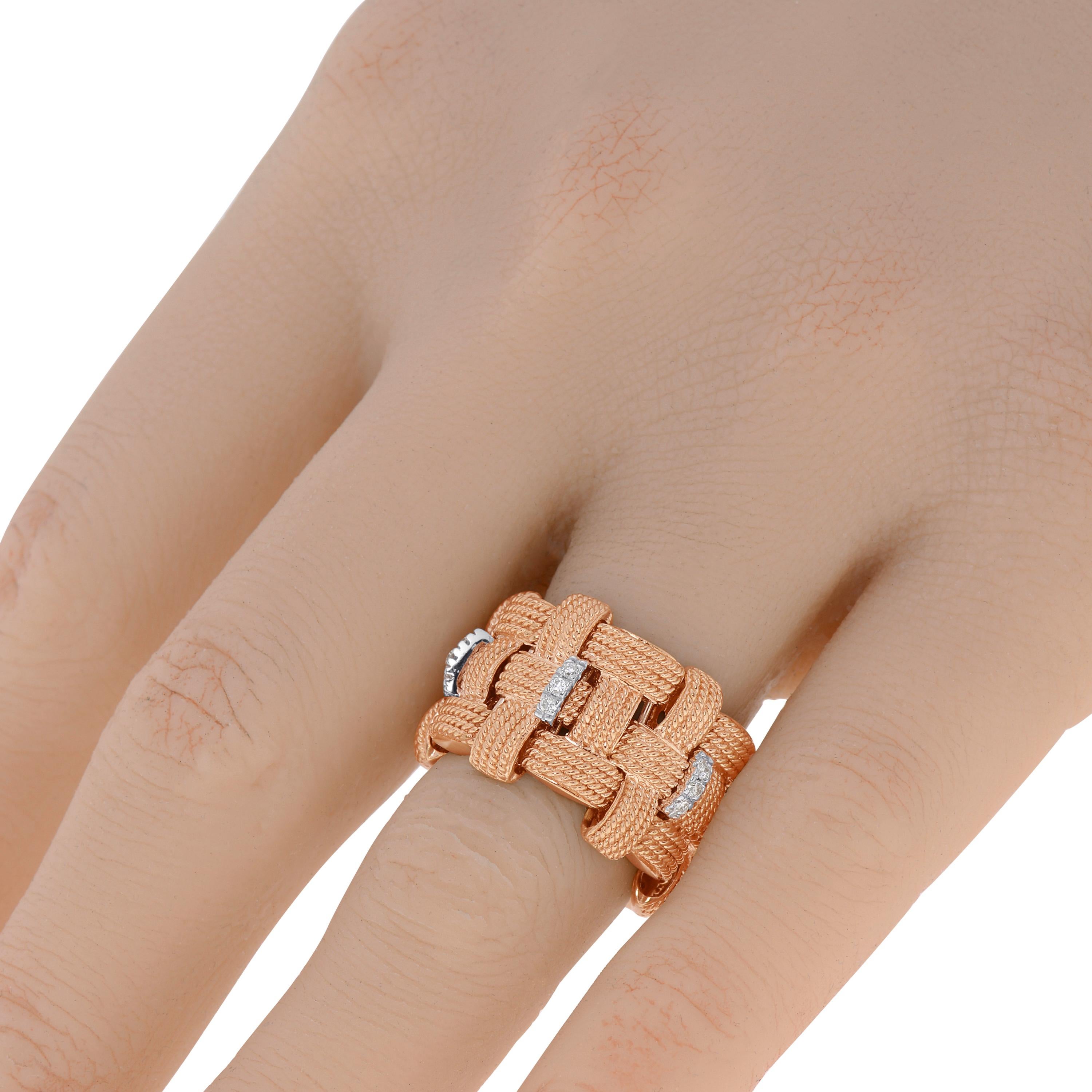 This beautiful Roberto Coin 18K Rose & White Gold Flexible Ring features 0.15ct. tw. diamonds set in 18K White Gold on a woven Rose Gold band. The ring size is 4.5 (48.0). The Band Width is 15mm. The Weight is 16.7g.
