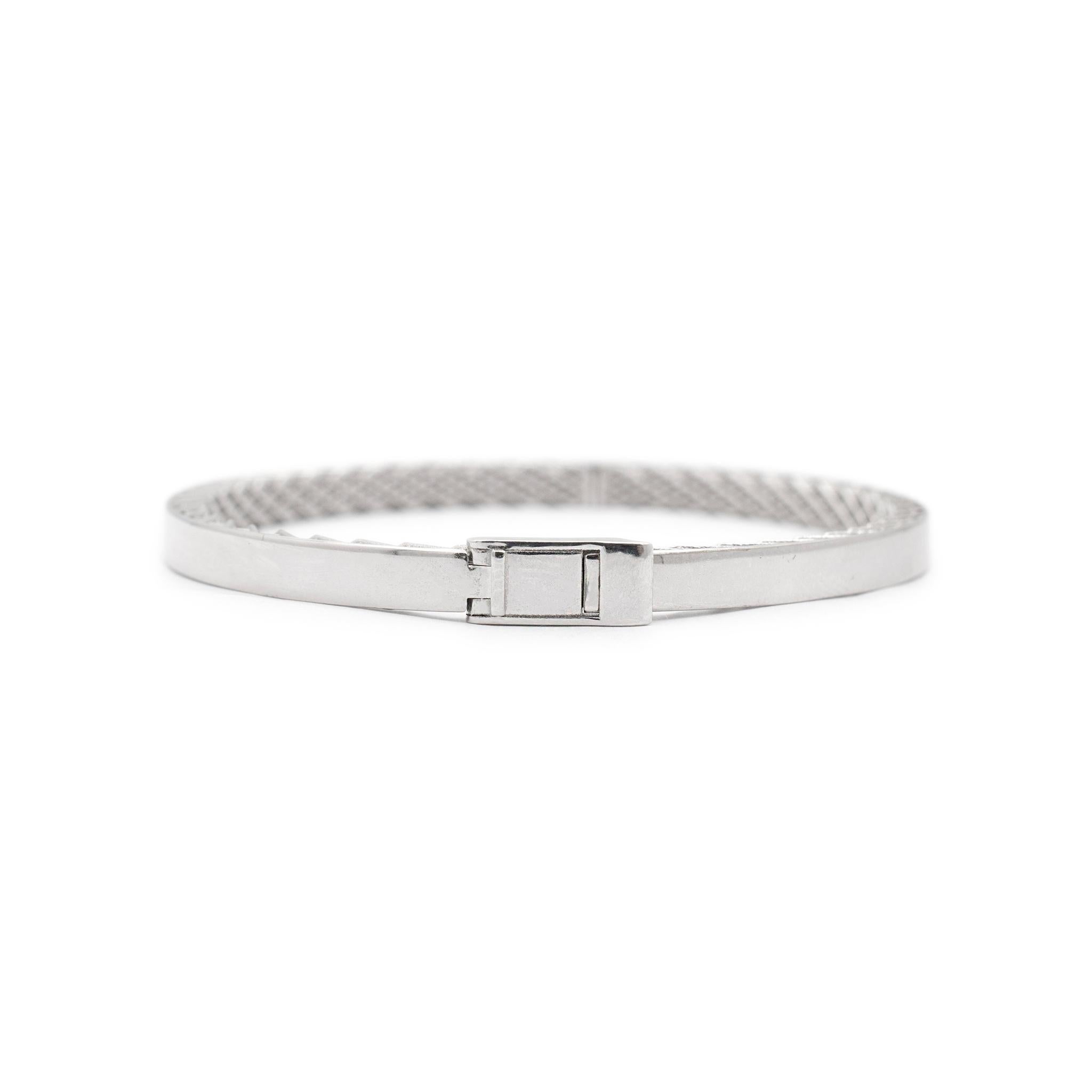 Brand: Roberto Coin

Gender: Ladies

Metal Type: 18K White Gold

Length: 6.00 inches

Width: 3.75 mm

Weight: 11.50 grams

18K white gold ruby bangle bracelet. Engraved with 