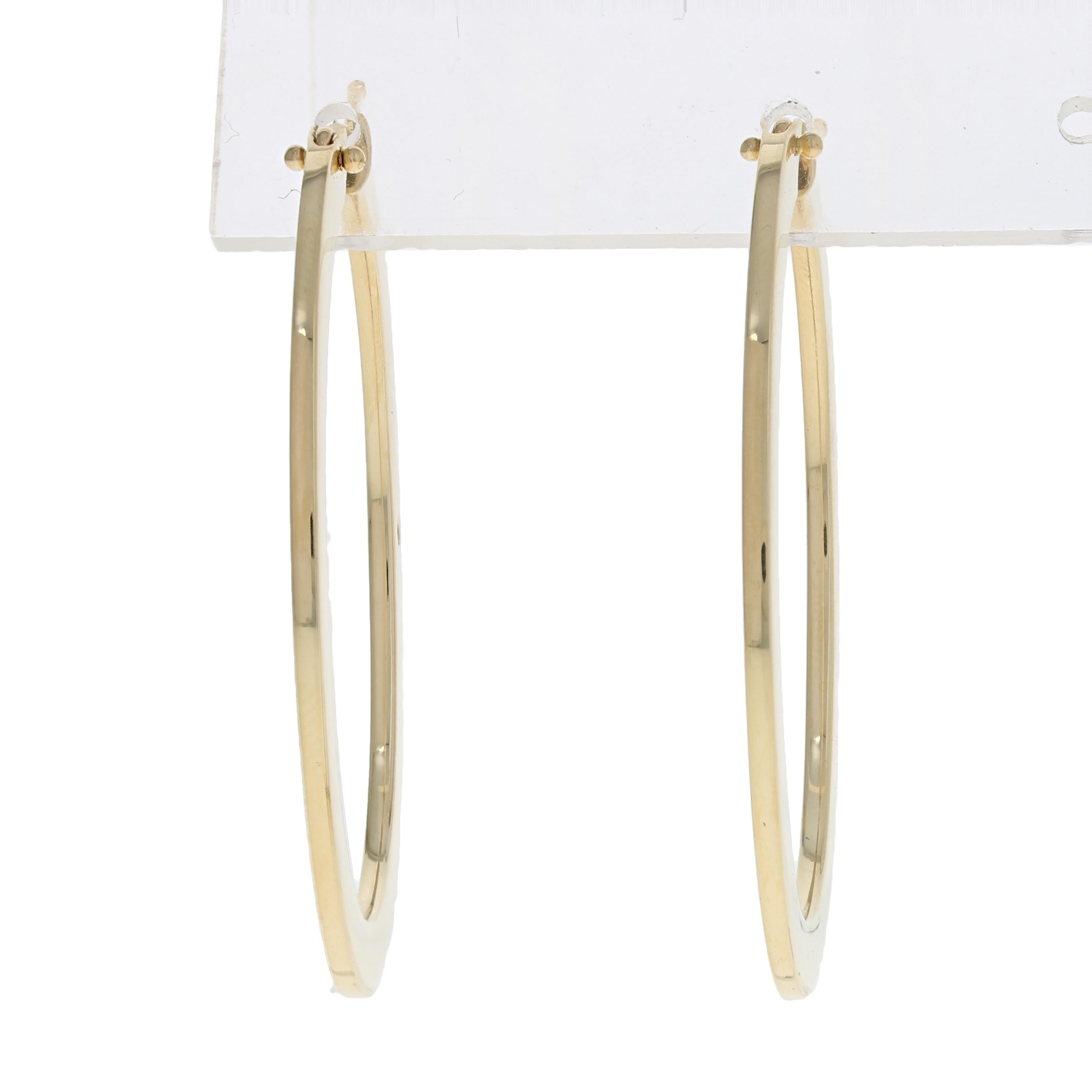 Originally retailing for $1200, these chic designer hoops are being offered here for a much more wallet-friendly price. 

Brand: Roberto Coin

Country of Origin: Italy
Metal Content: Guaranteed 18k Gold as stamped

Stone Information: 
Synthetic