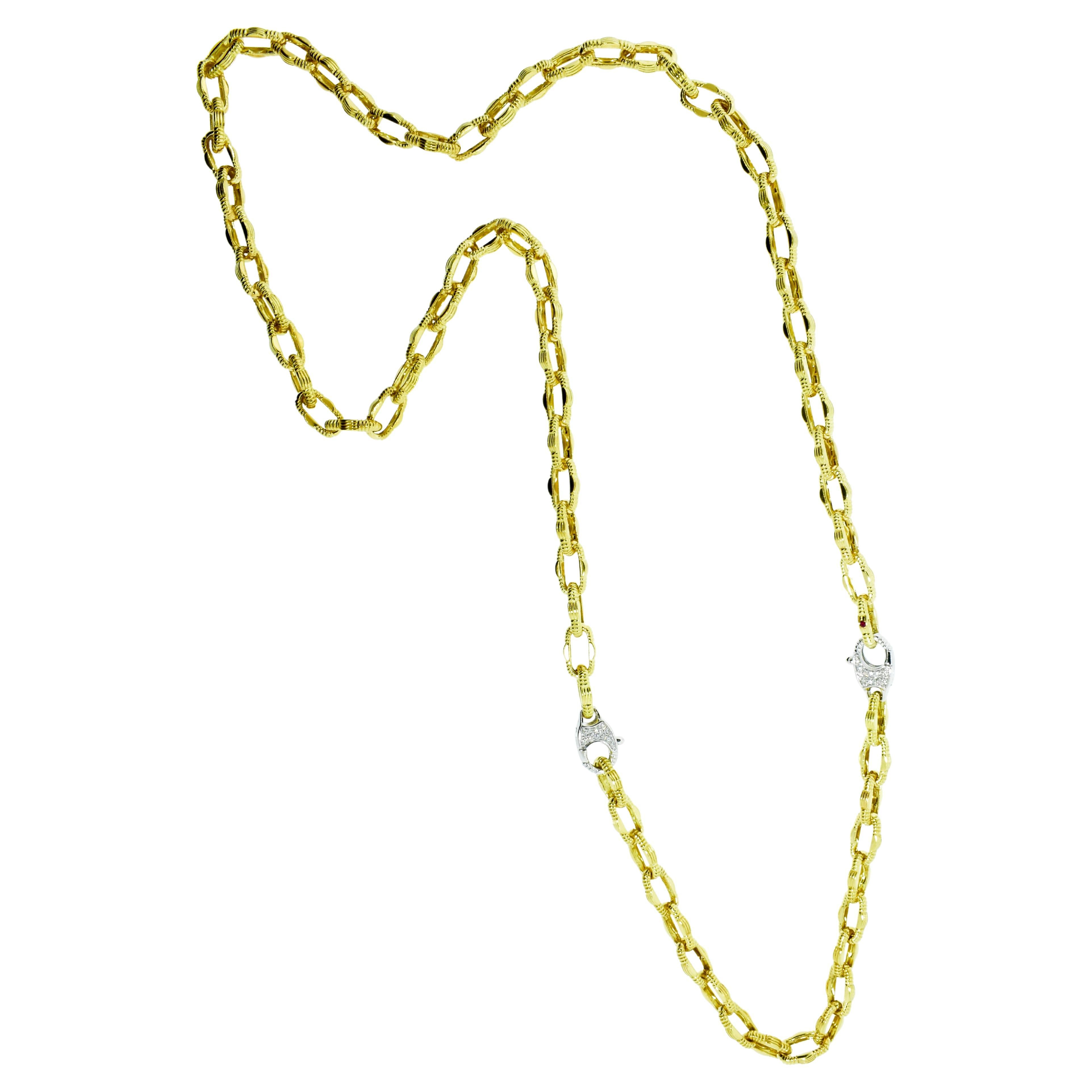 Roberto Coin 18K long chain and bracelet.  This vintage piece  is in excellent condition.  It can be worn long at slightly over 30 inches, or as a shorter necklace at 22.5 inches by removing the bracelet portion which is 8 inches long.  The diamond