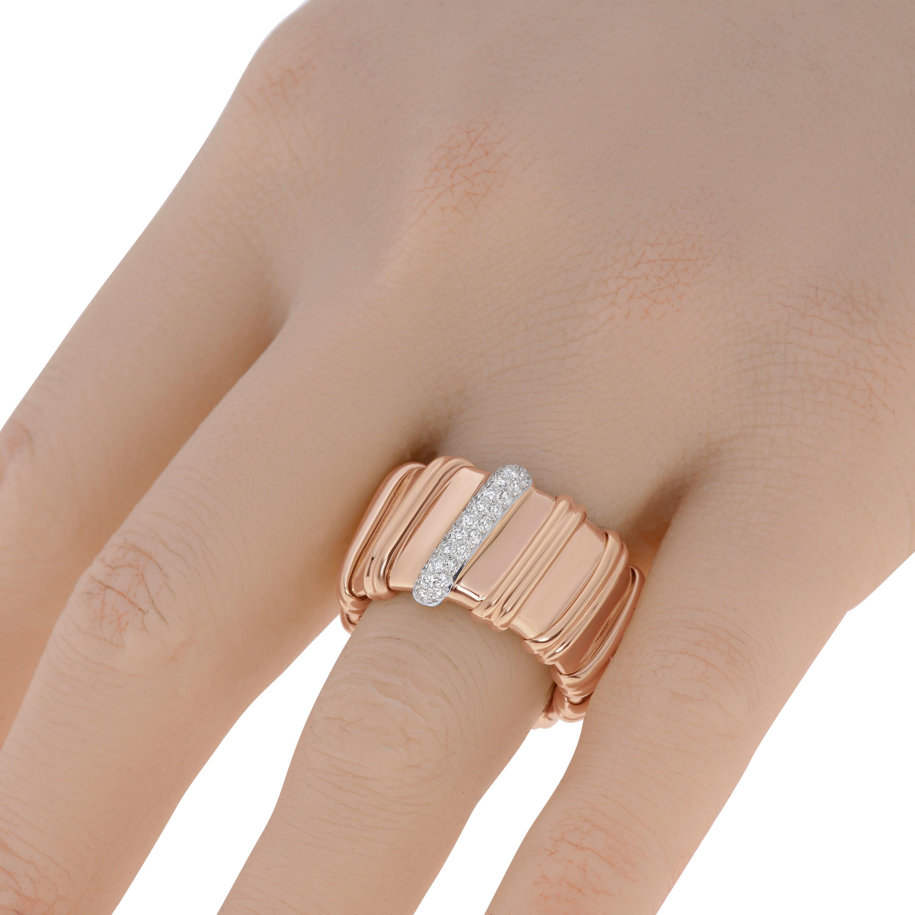 This stylish Roberto Coin 18K rose gold band features diamonds 0.30ct twd. The band is flexible and has size 7.  The band width is 15mm. The total weight is 15.5g. This designer jewelry is shipped with a Roberto Coin Pouch.
