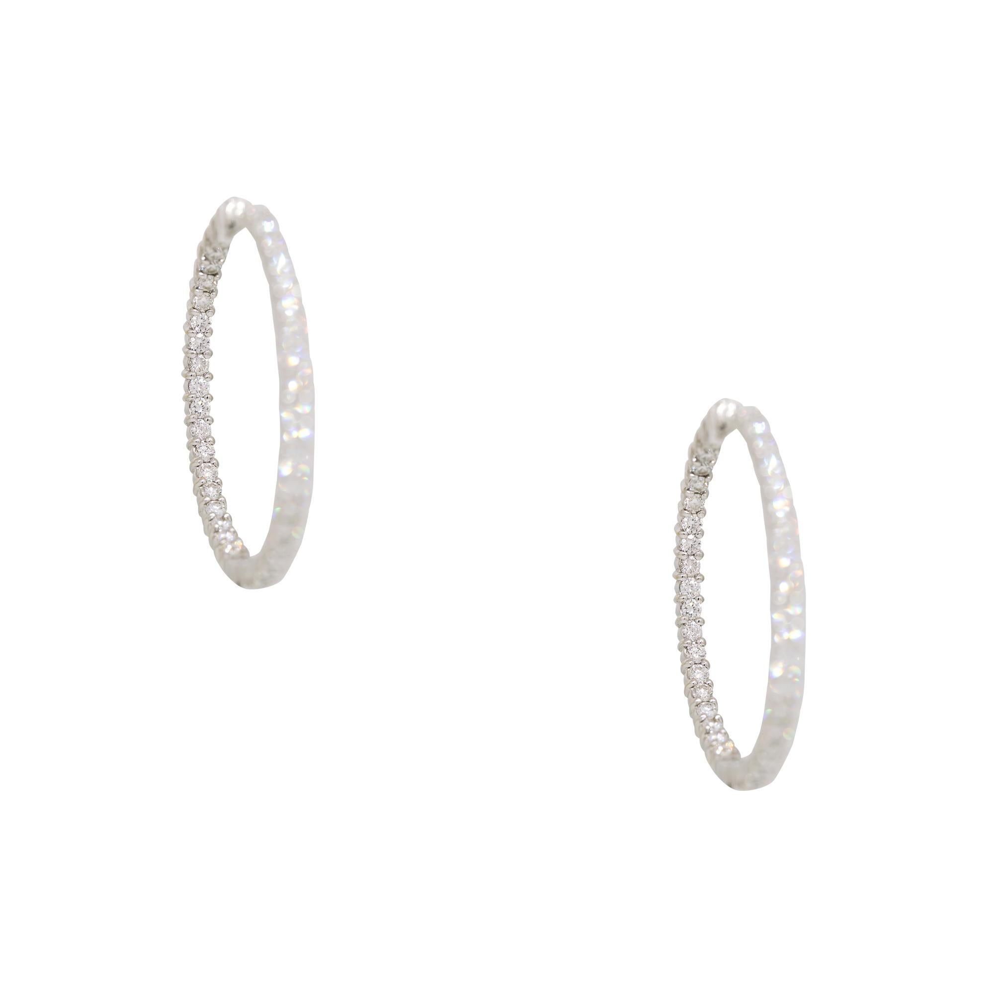 Roberto Coin Natural 3.43 Carat Diamond 18-Karat Hoop Earrings

These Roberto Coin, 18k white gold hoop earrings feature 3.43 carats of natural round brilliant-cut diamonds. The elegant design combines timeless sophistication with brilliant sparkle,
