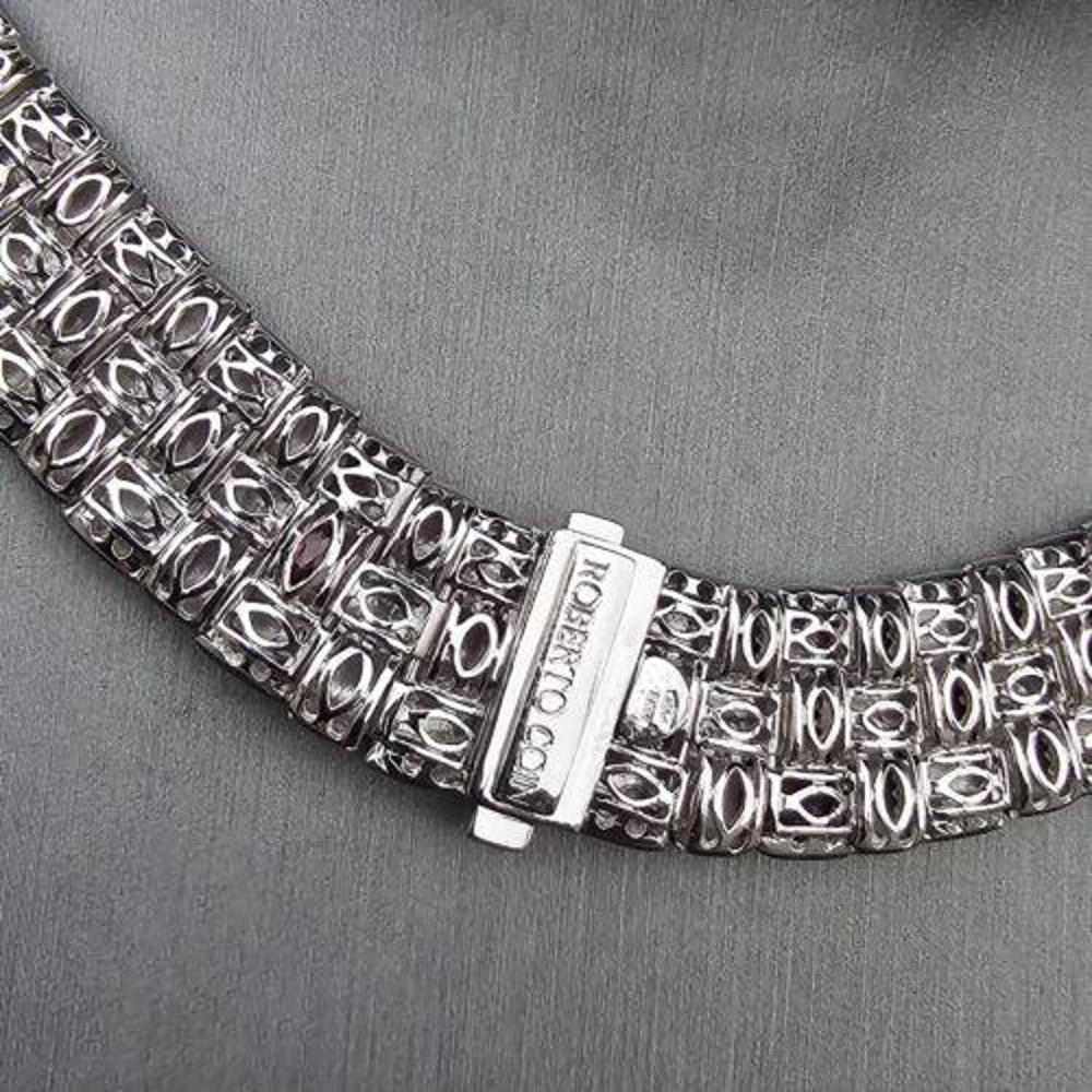 This beautiful Roberto Coin necklace is a stunning addition to any jewelry collection. Crafted from 18k white gold, this choker-style necklace features the iconic Appassionata design, with Yellow gold pave Diamond clasp. The necklace measures 14