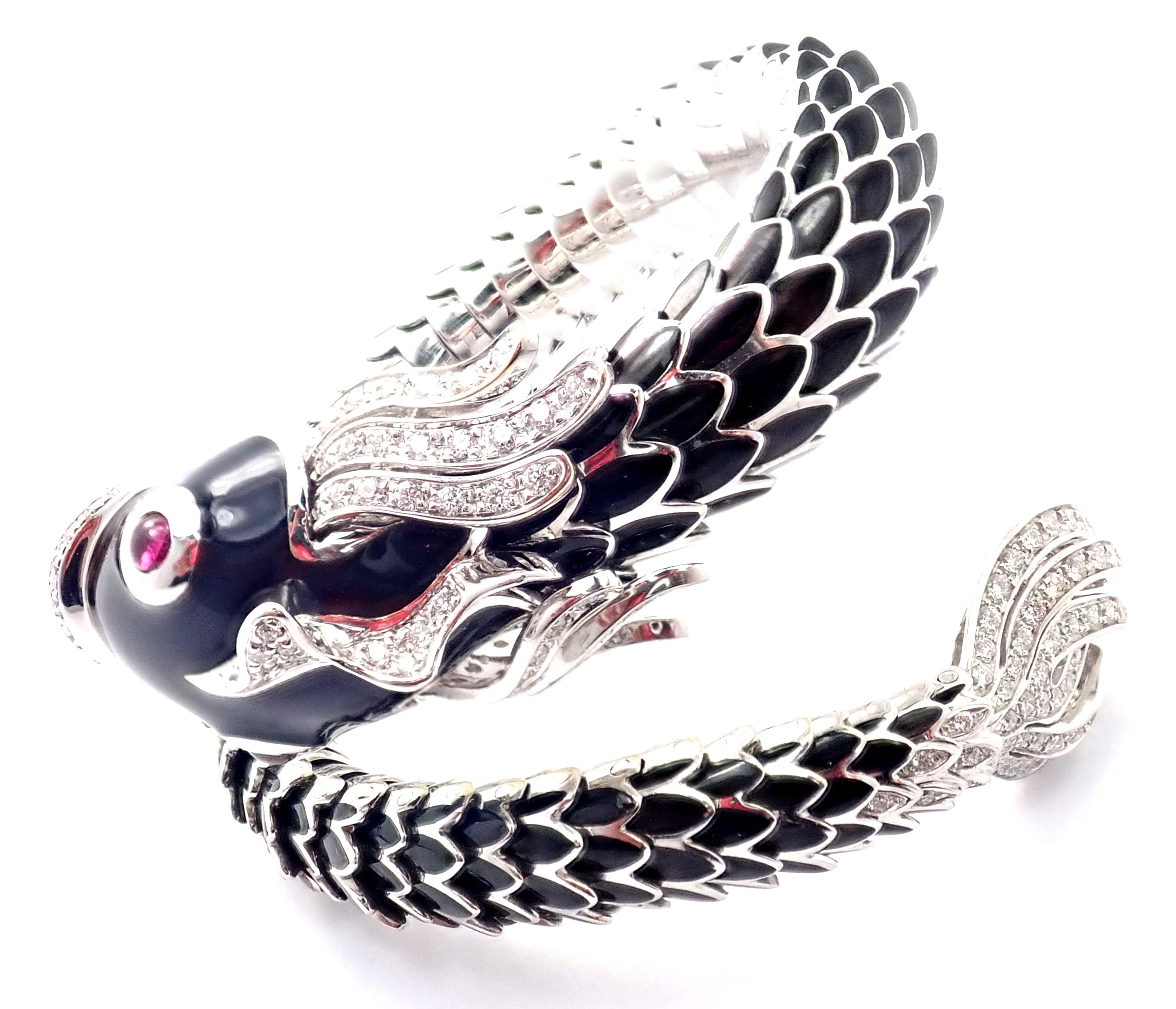 18k White Gold Nemo Diamond & Ruby Enamel Bangle Bracelet by Roberto Coin. 
With 133 round brilliant cut diamonds, VS1 clarity, G color. Total Diamond Weight: 2ct. And 2 cabochon rubies, 4mm each.
This is a absolutely gorgeous Limited Edition