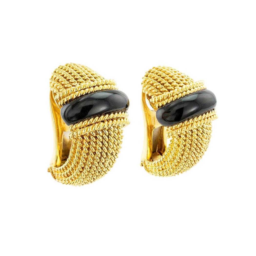 Roberto Coin onyx and yellow gold clip-on post half hoop earrings. *

SPECIFICATIONS:

GEMSTONES:   two custom-cut black onyx cabochons.

METAL:  18-karat yellow gold.

WEIGHT:  17.2 grams.

EARRING BACKS:  clip backs with hinged, folding posts,