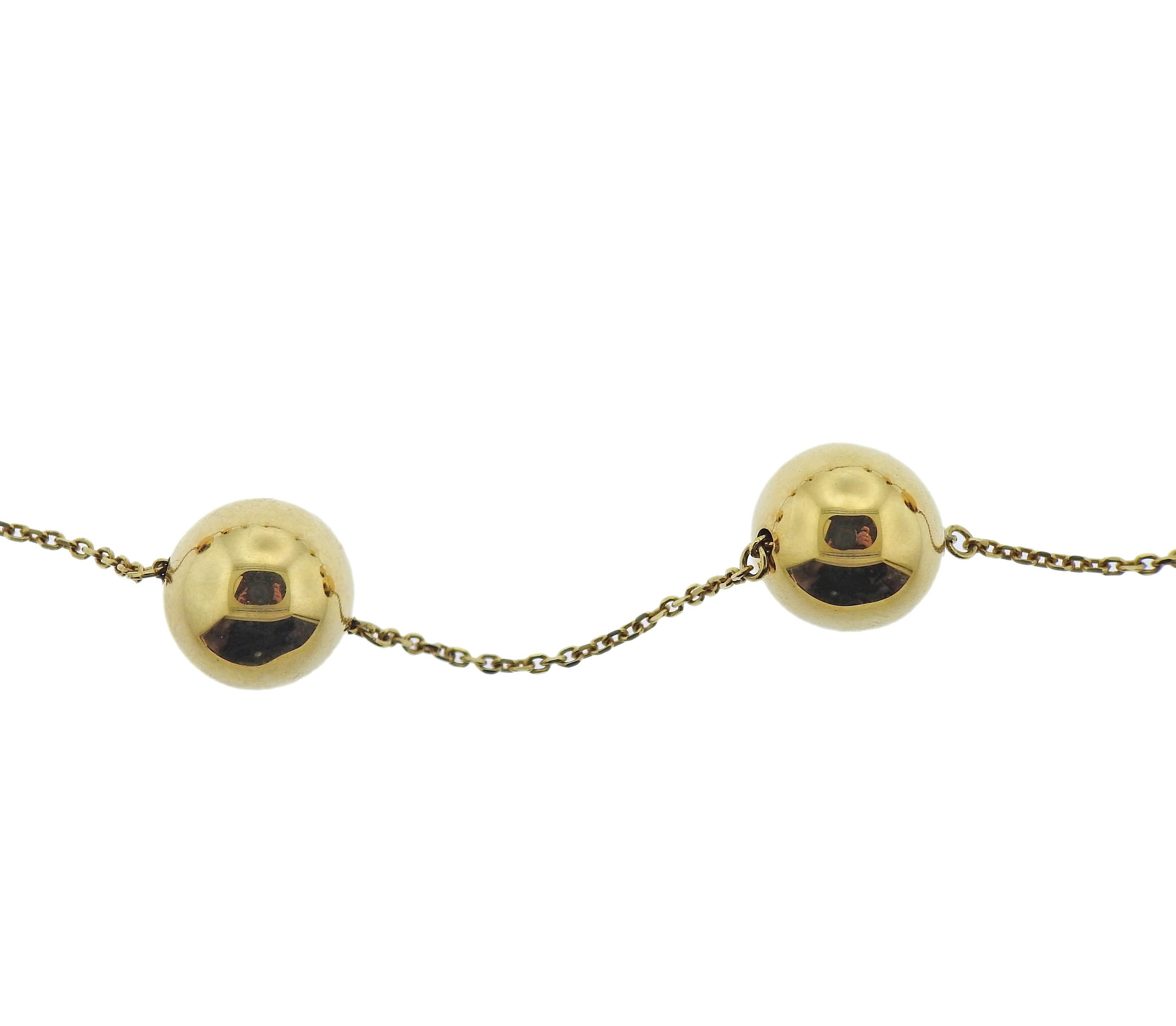 18k yellow gold Pallini ball station necklace by Roberto Coin. Necklace is 17.25