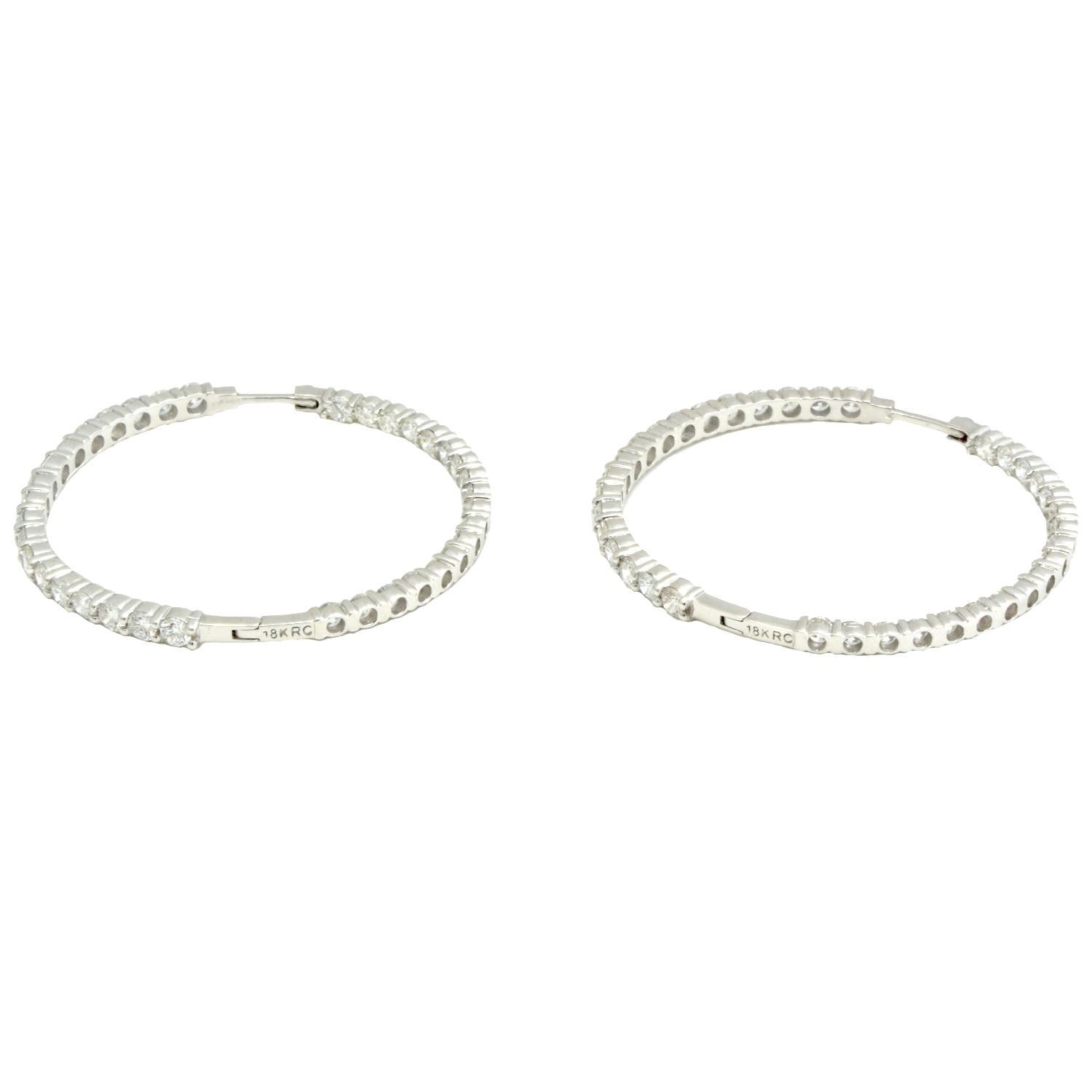 Designer:  Roberto Coin

Collection: Perfect Hoop

Style:  Diamond Hoops

Metal Type: White  Gold 

Metal Purity: 18k

Stones: 72 Round Brilliant Cut Diamonds

​​​​​​​                1 Ruby 

Hoop Diameter : 1.8