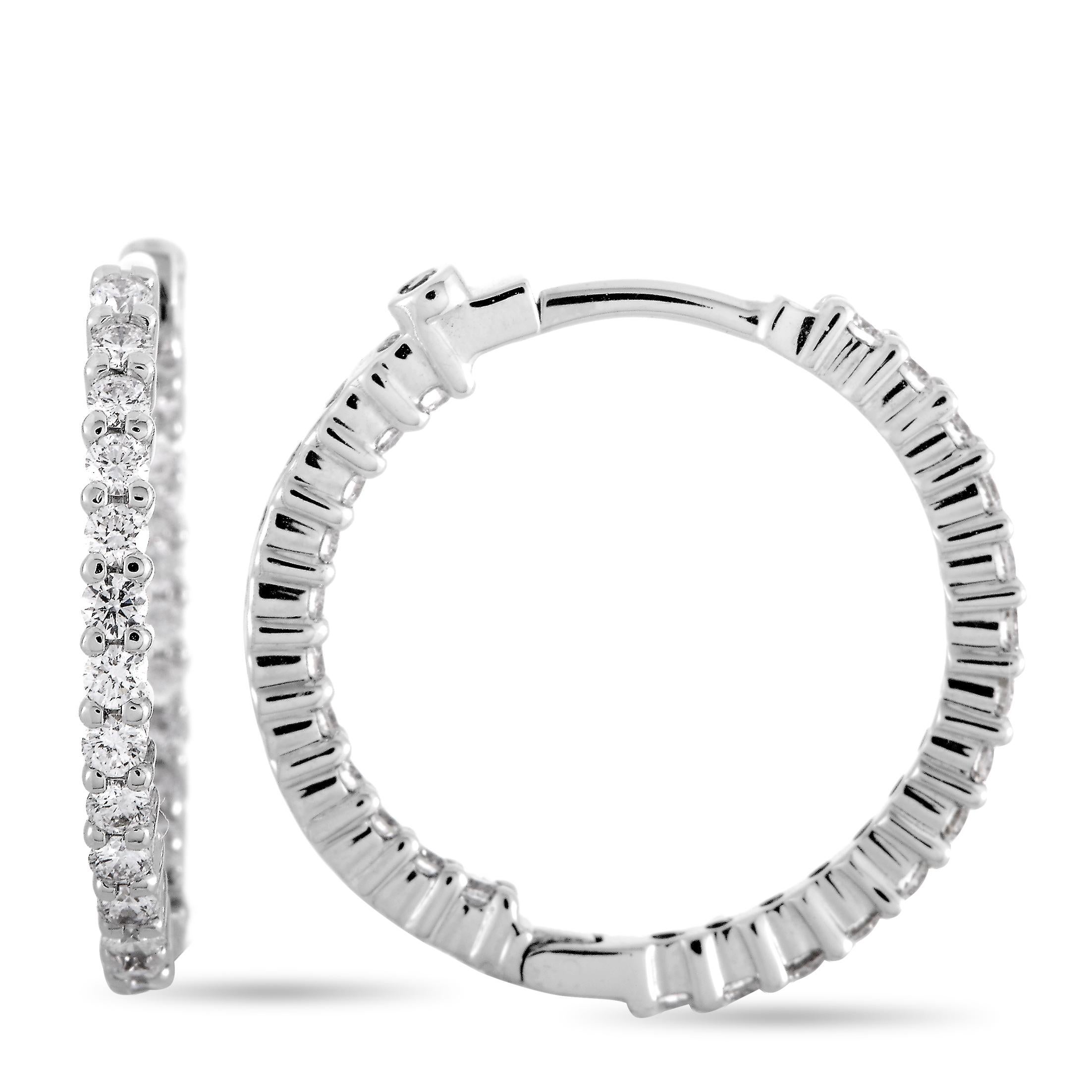 The Roberto Coin “Perfect Hoops” earrings are made out of 18K white gold and diamonds that weigh 1.00 carat in total. The earrings measure 0.88” by 0.15” and each of the two weighs 2.5 grams.
 
 This pair of earrings is offered in brand new