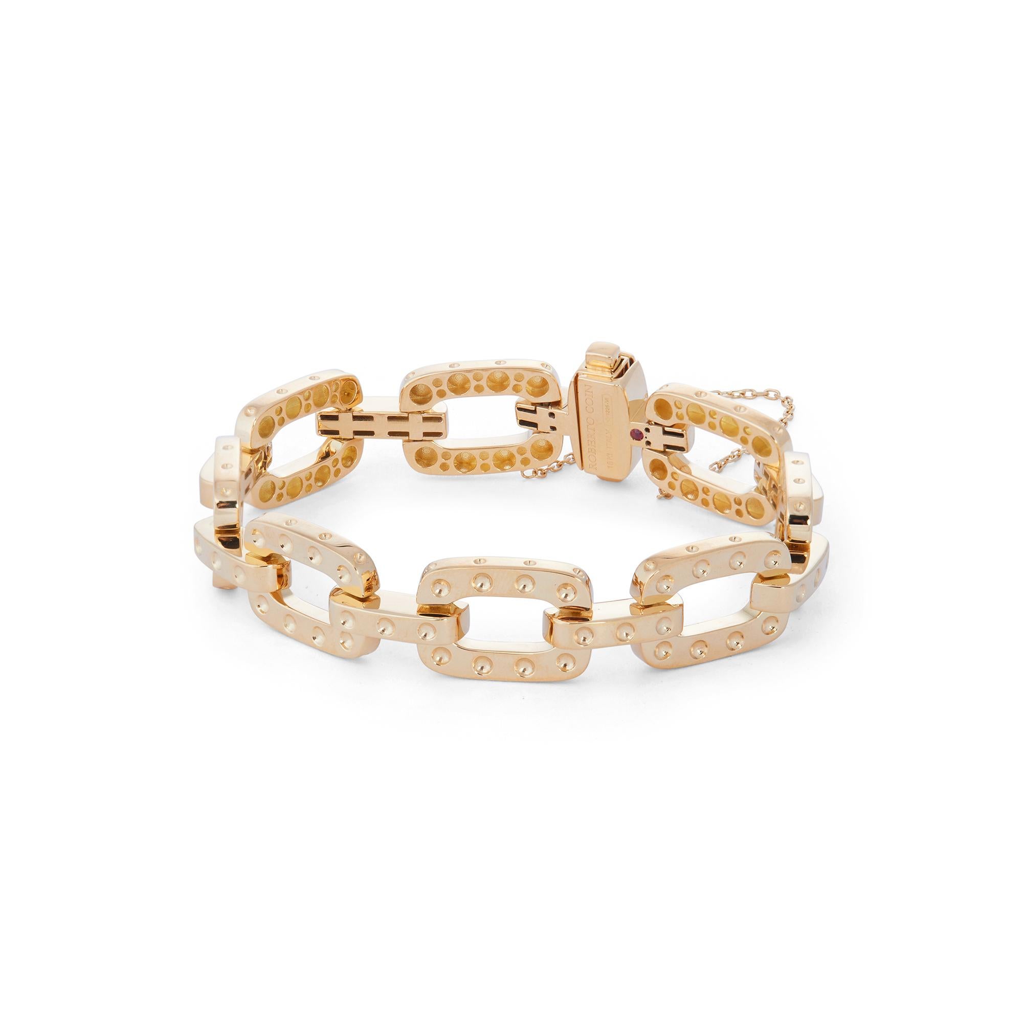 Authentic Roberto Coin Pois Moi bracelet crafted in 18 karat yellow gold. The high polished links are adorned with Coin's signature Pois Moi dots.  The bracelet measures 7 inches in length and 1/2 inch wide.  Signed Robert Coin, 18kt, Italy with the