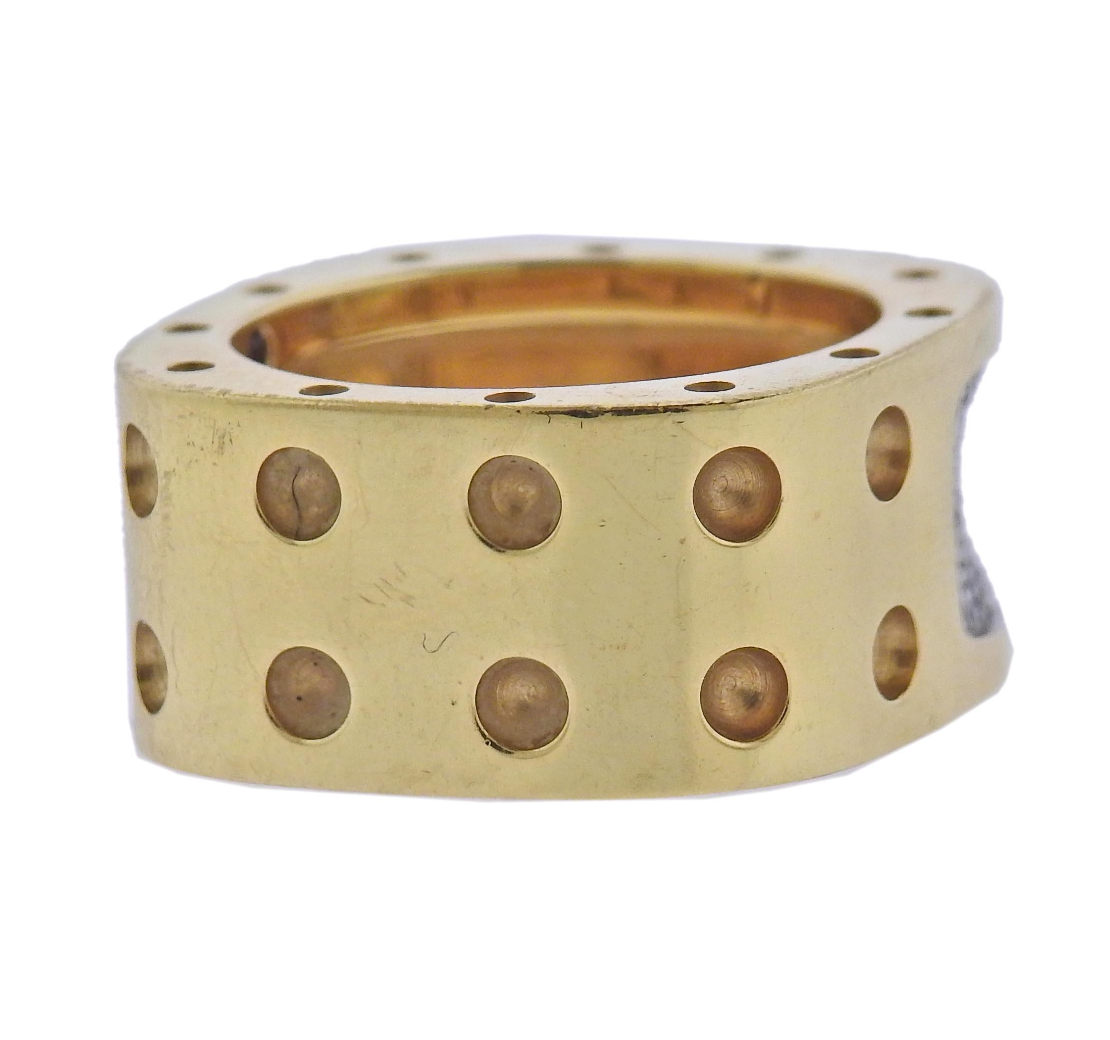 18k yellow gold by Roberto Coin with approx. 0.28ctw in diamonds. Ring size 6 3/4, ring band is 10.7mm wide. Marked: Ruby Maker's mark 18k RC. Weight - 11.8 grams.