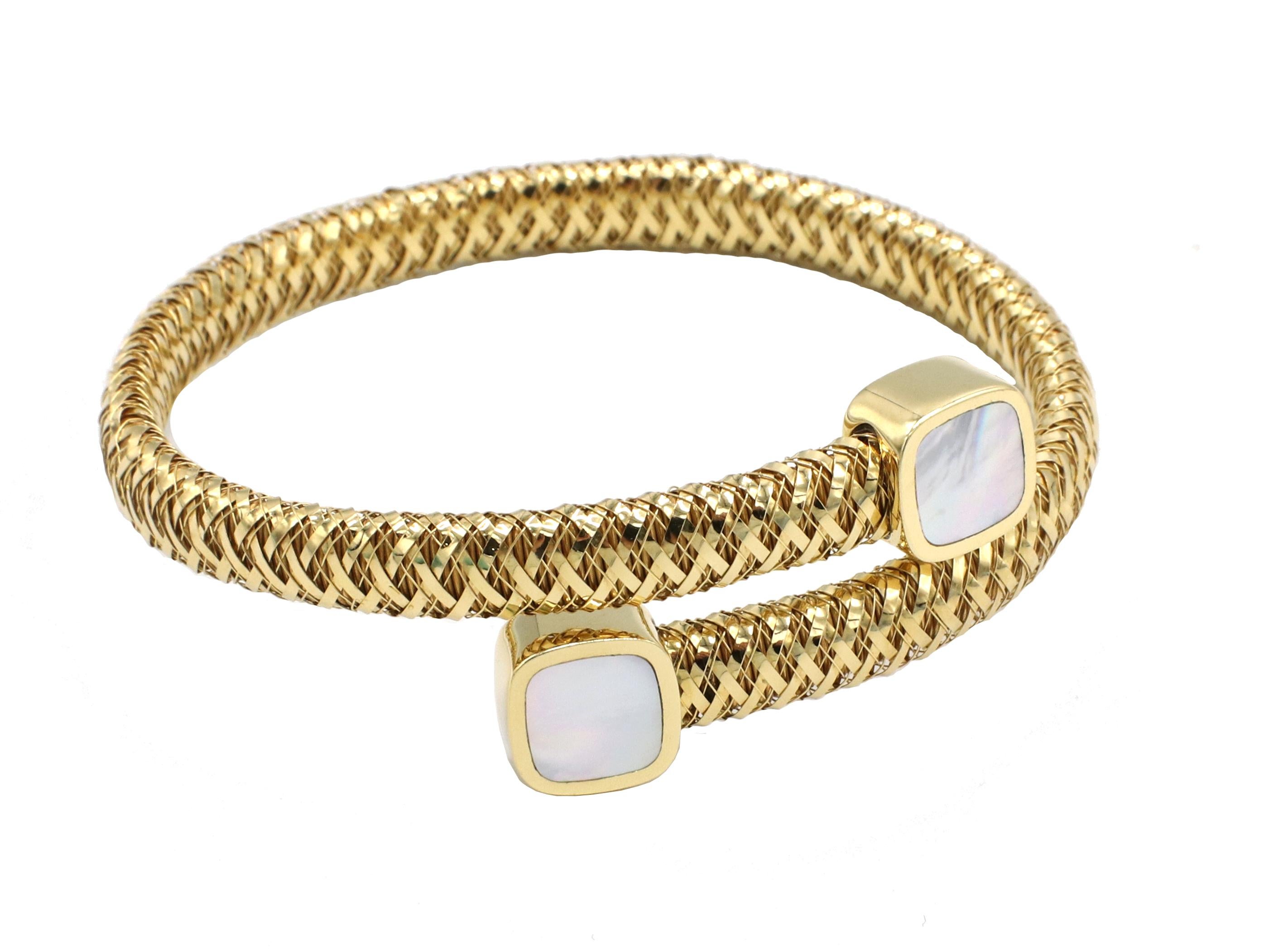 Roberto Coin Primavera 18 Karat Yellow Gold Mother Of Pearl Bypass Coil Bracelet
Metal: 18k yellow gold
Weight: 18.91 grams
Width: 7-10mm 
Signed: RC 750 18K ITALY
Wrist size: 6.5 inch (slightly flexible) 
