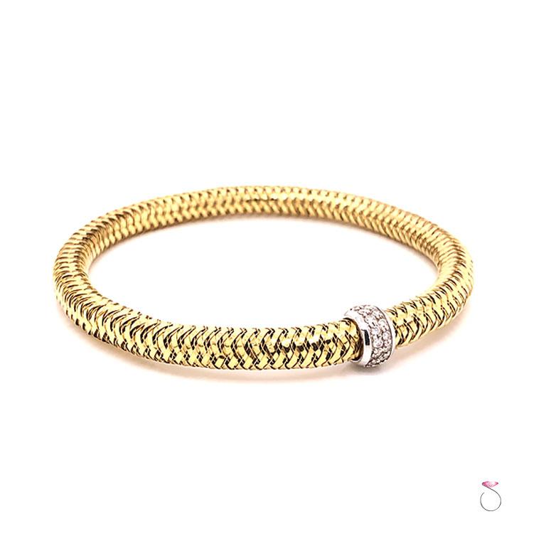 Roberto Coin Primavera flexible bangle bracelet in 18k yellow gold and diamonds. Beautifully crafted and features a flexible woven body with a white gold section at the center, Pave' set with diamonds. The total carat weight of diamonds is 0.14