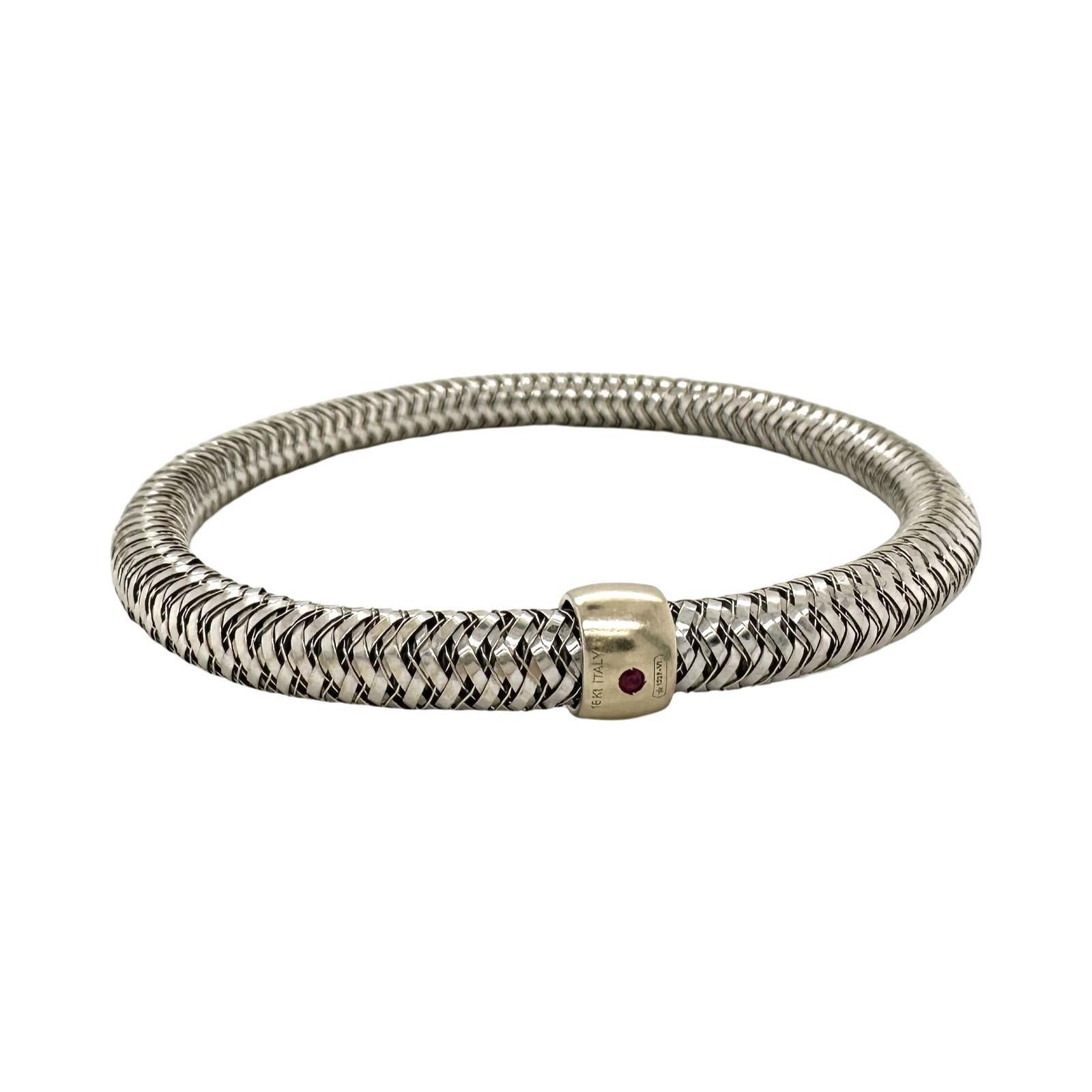 Brand: Roberto Coin
Collection: Primavera 
Style: Flexible Bracelet
Material: White Gold
Metal Purity: 18k
Stones: 1 Ruby (signature RC)
Total Item Weight (grams): 12.8
Bracelet Size: fits a wrist up to 6.75 inches
Includes: Brilliance Jewels