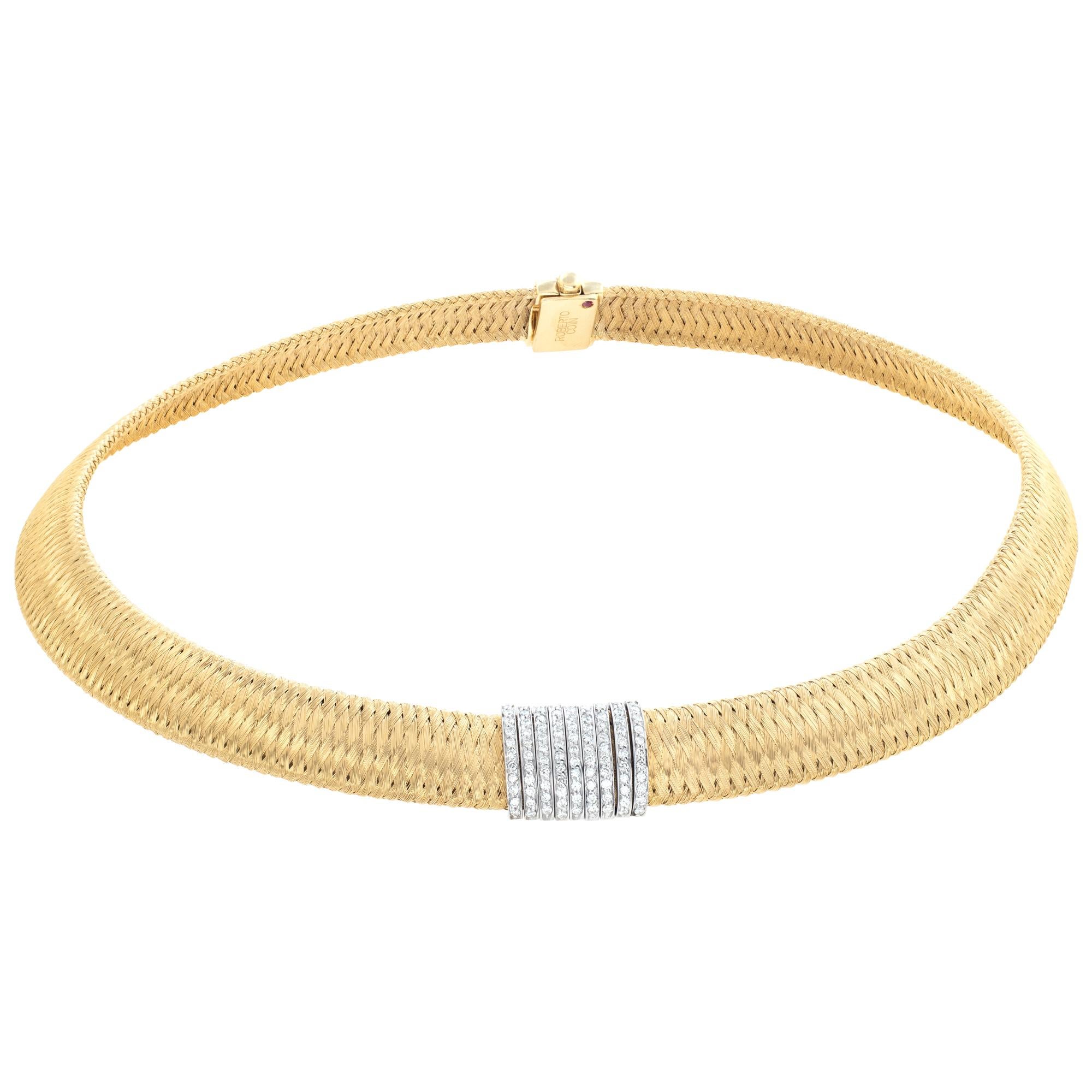 Exceptional weaved texture of prestigious 18K yellow gold is revealed upon a closer look at this glamorous necklace from Roberto Coin which is also embellished with resplendent diamonds weighing in total 0.50ct upon the complementing 18K white gold