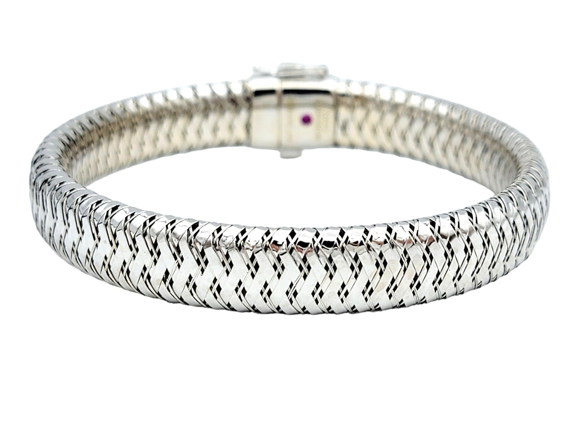 The inner circumference of this bracelet measures 6.38 inches and will comfortably fit up to a 6.25 inch wrist. 

The Roberto Coin Primavera flex bangle bracelet is a stunning piece crafted from luxurious 18 karat white gold. Its flexible design