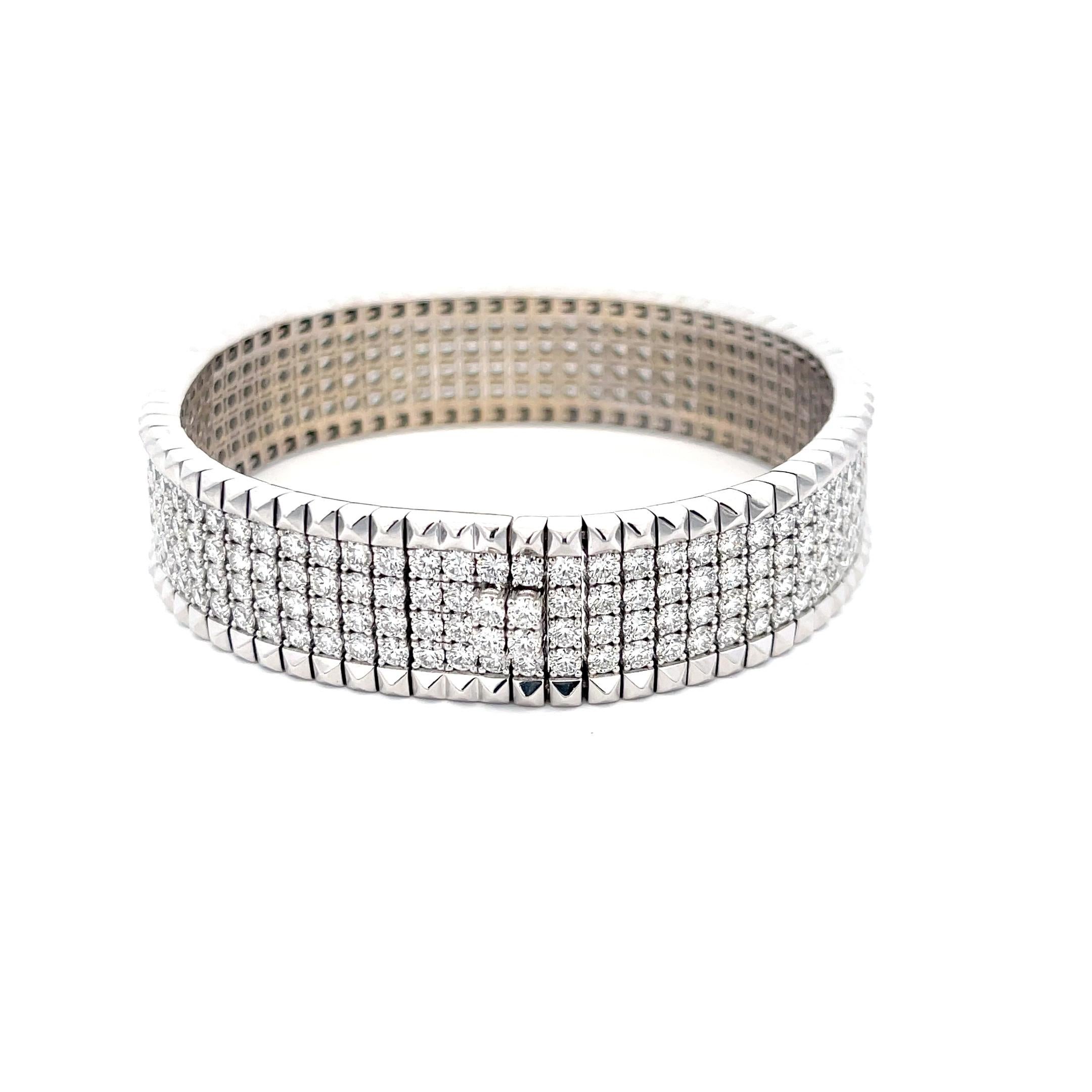 Estate Roberto Coin Bracelet in 18K White Gold from the Rock & Diamonds Collection. The bracelet features a trim of pyramid studs and in the center four rows of pave diamonds with a total weight of 15.35 carats. Normal retail is $69,500!  
7