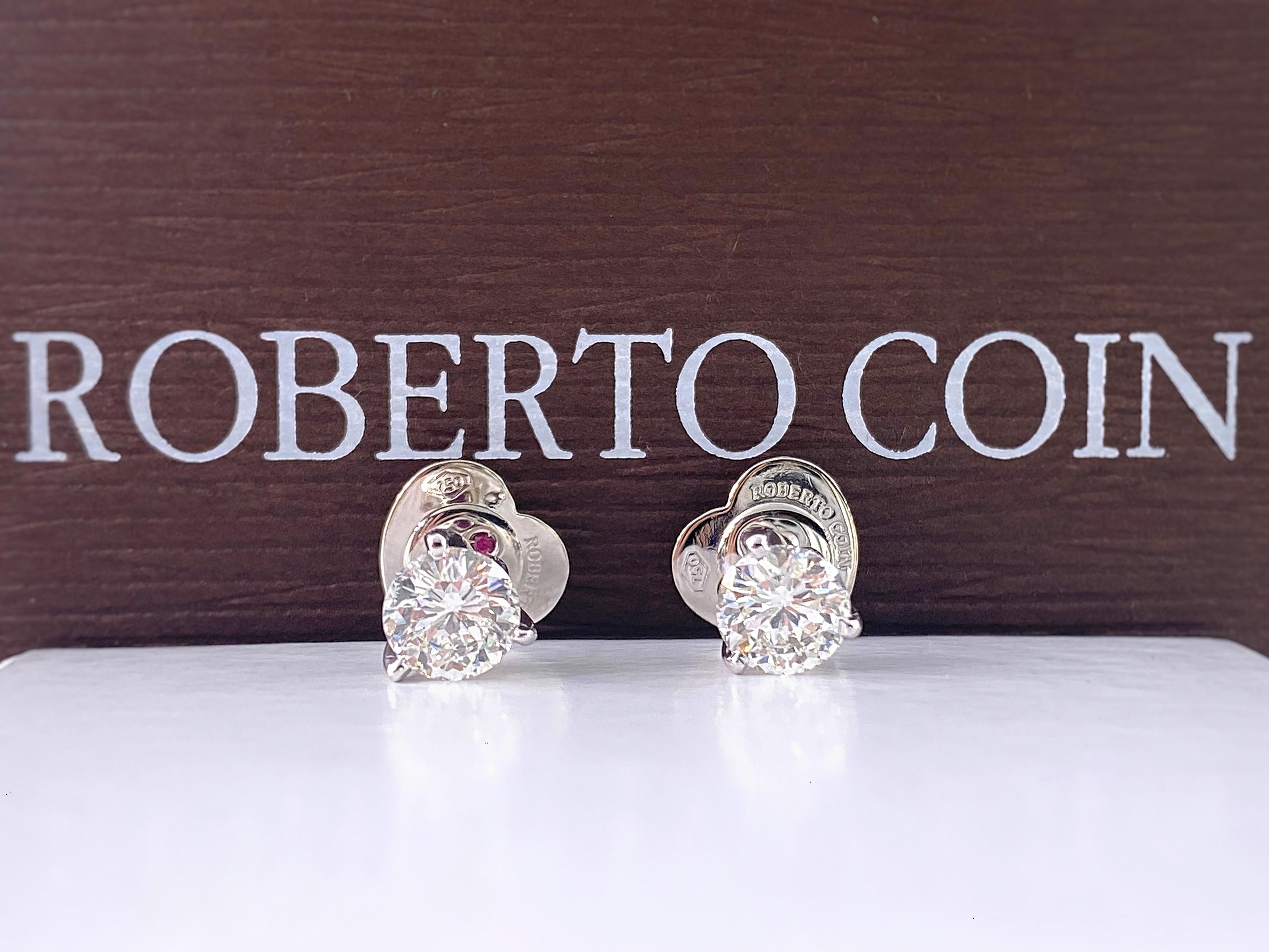 Roberto Coin Cento Diamond Stud Earrings
Style:  Studs with Tulip Setting
Ref. number:  #004987/#007326
Metal:   18kt White Gold
Backs:  Roberto Coin Heart Shape Push Back for Pierced Ears
TCW:  2.08 tcw
Diamond #1:  #007326 1.03 cts I, VS2 
Diamond