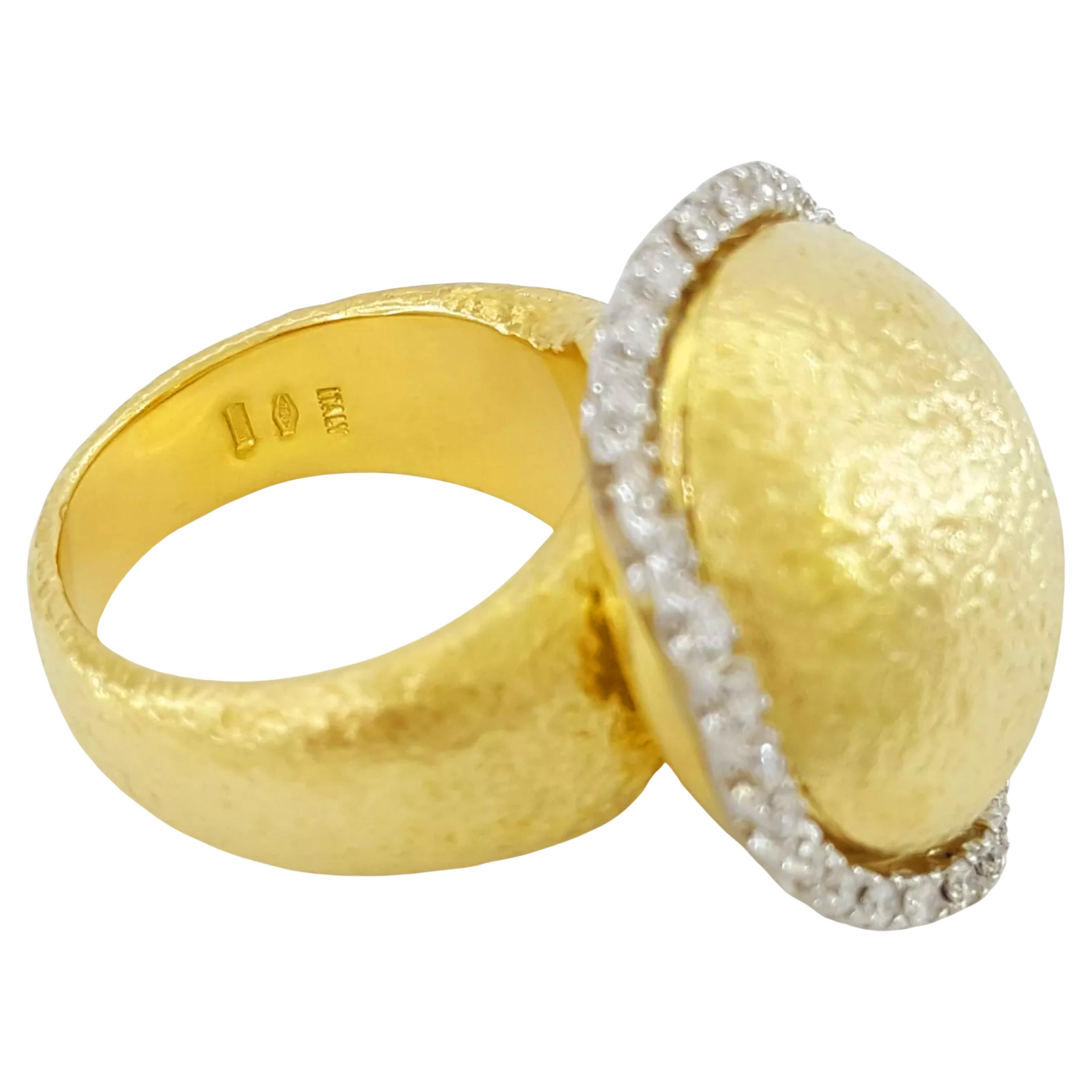 Roberto Coin round diamond texture halo ring is a striking and unique piece in 18K yellow gold. It weighs 20.1 grams, offering a substantial feel and presence on the finger. The ring is a size 6.5 and has dimensions of 23.8 mm in width and 13.3 mm