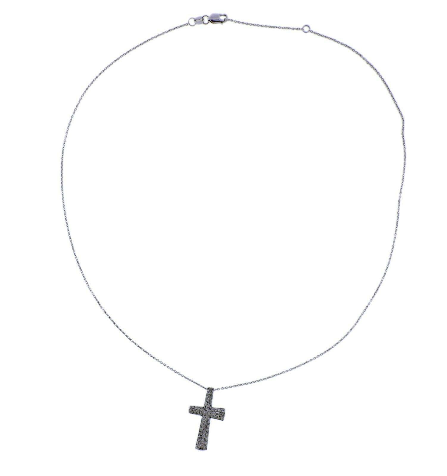 New Roberto Coin Scalare cross necklace in 18k white gold with cross pendant, approx. 050ctw in G/VS diamonds. Retail $2400. necklace is approx 18